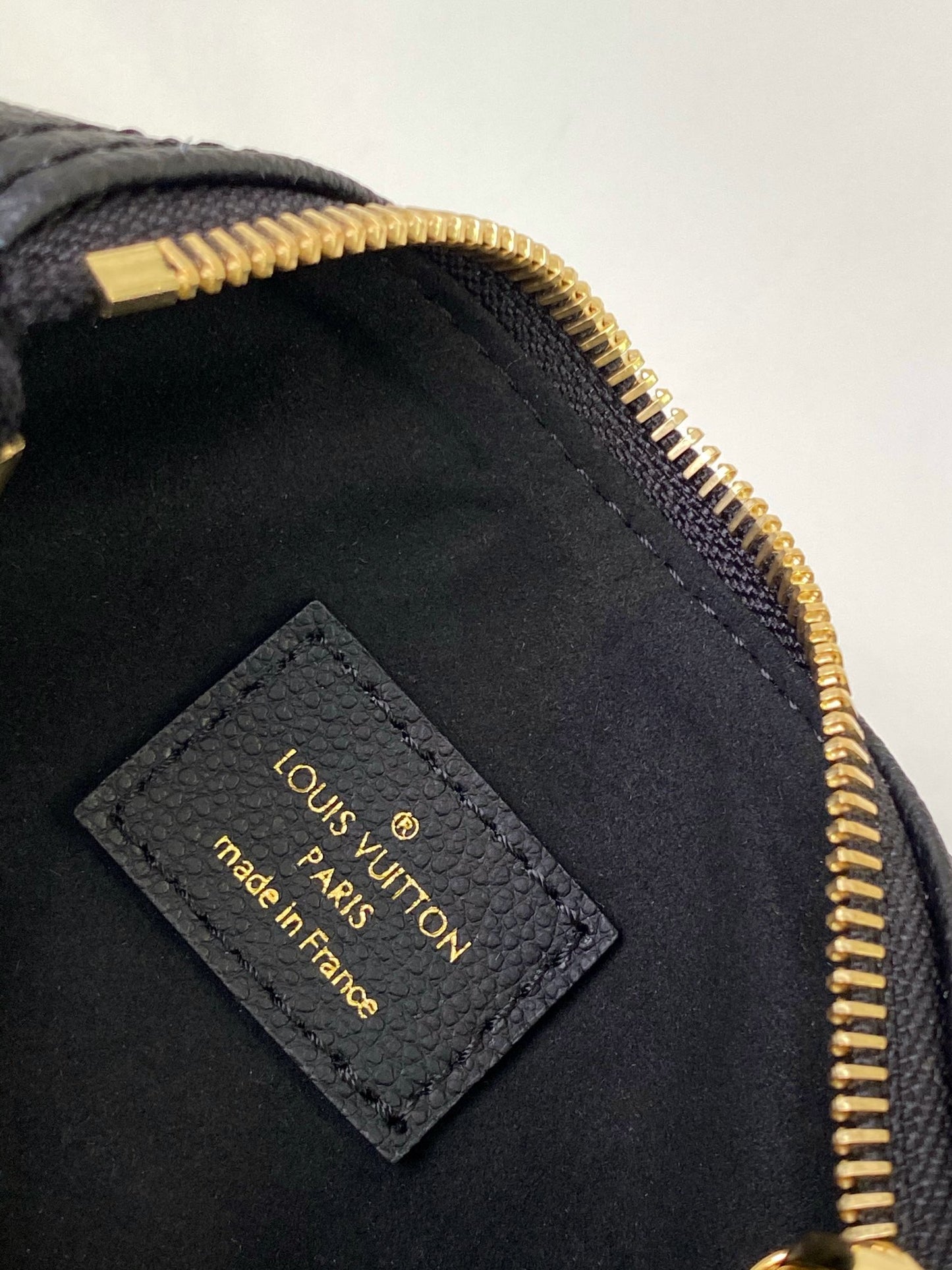 Louis Vuitton Elegant Black Mini Barrel Handbag with Gold Monogram Motifs