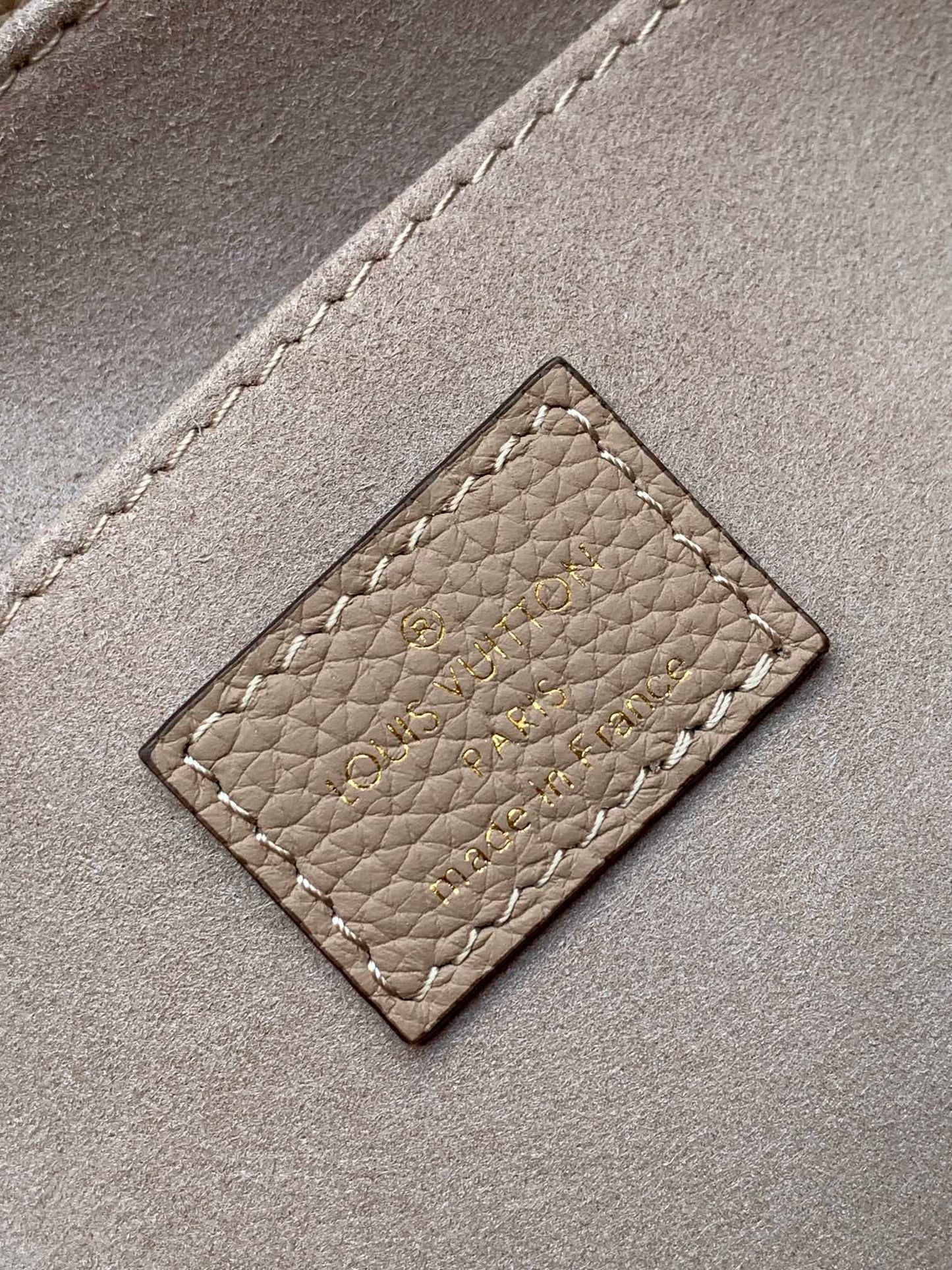 Louis Vuitton Elegant Beige Monogram Embossed Leather Top Handle Handbag