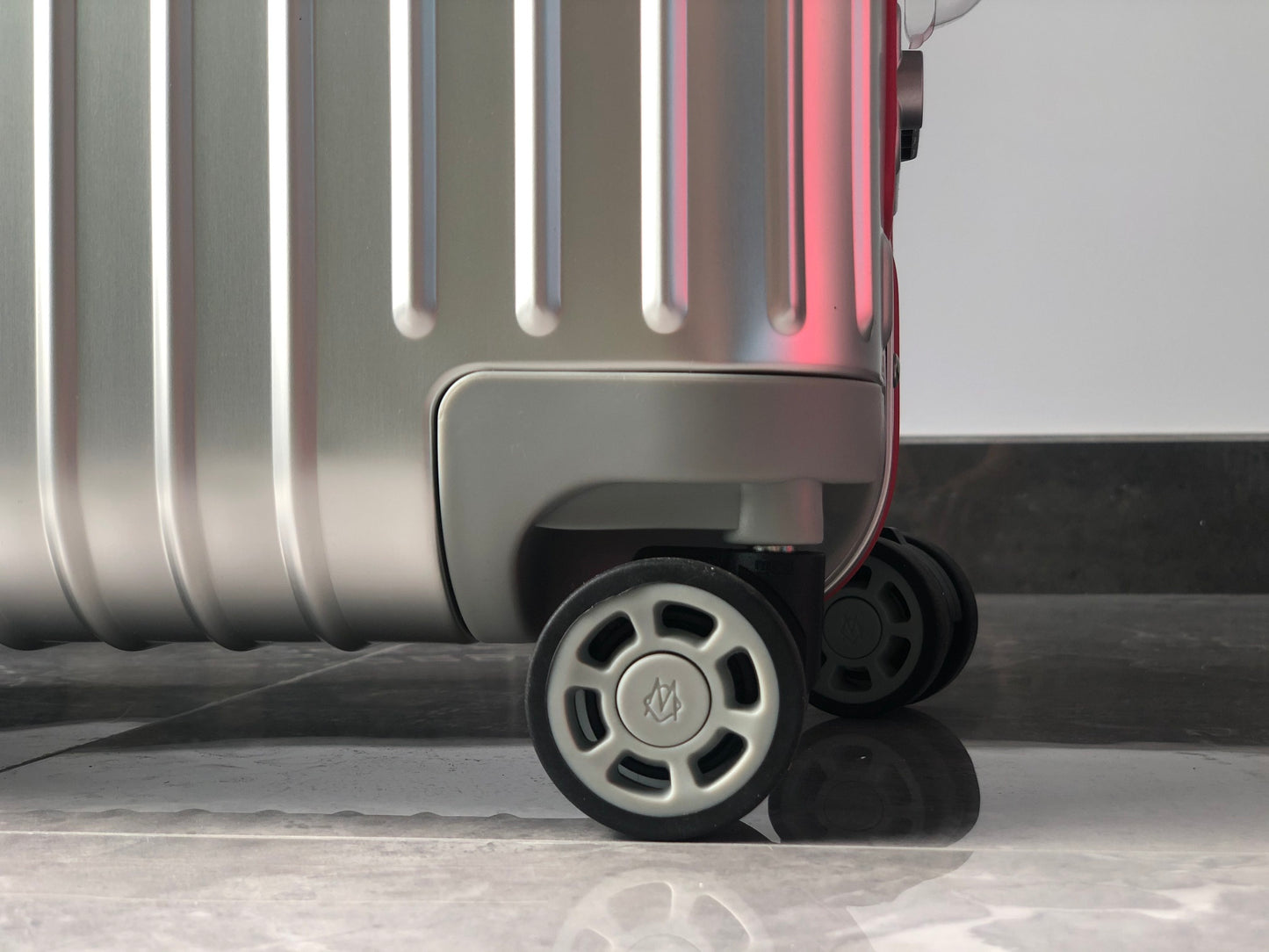 Silver Metallic Hardside Spinner Suitcase with Pink Accent