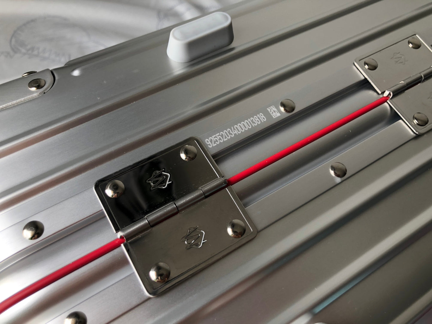 Silver Metallic Hardside Spinner Suitcase with Pink Accent