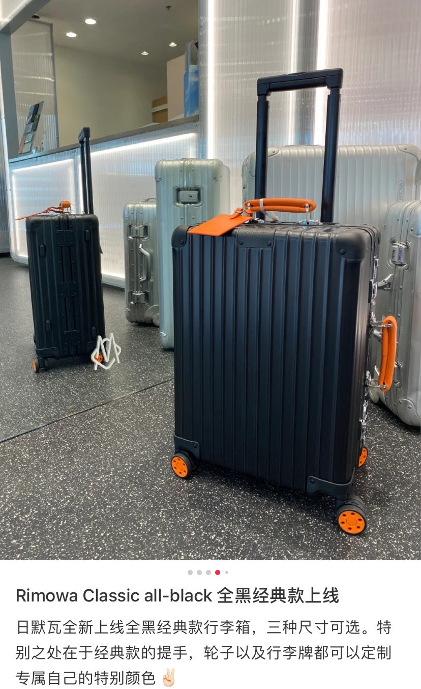 Matte Black Ribbed Hardside Spinner Suitcase with Orange Accents