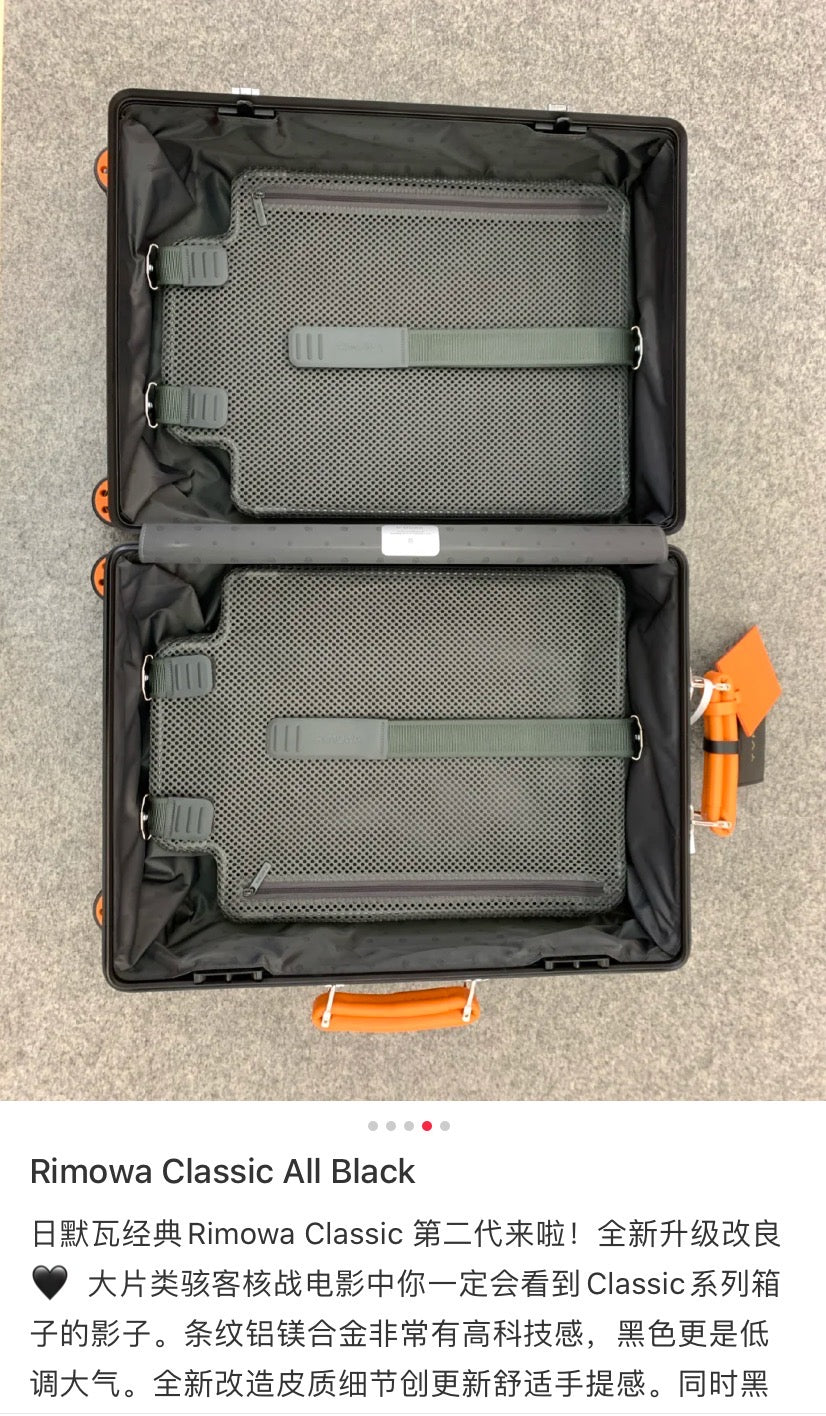 Matte Black Ribbed Hardside Spinner Suitcase with Orange Accents