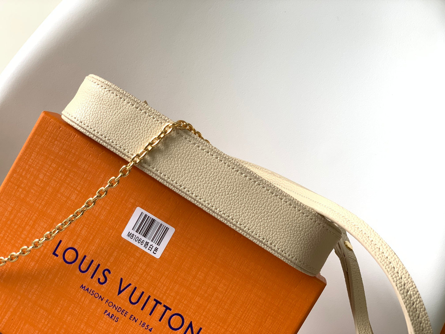Louis Vuitton Elegant Cream Embossed Vegan Leather Underarm Bag with Gold Chain