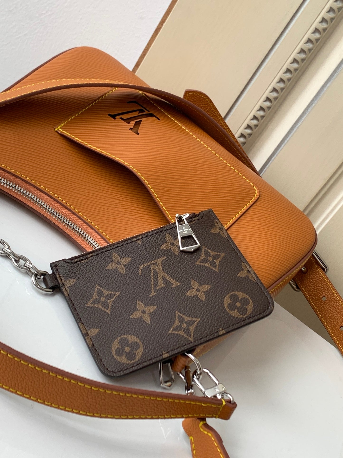 Louis Vuitton Tan Leather Shoulder Bag with Front Pocket and Chain Detail