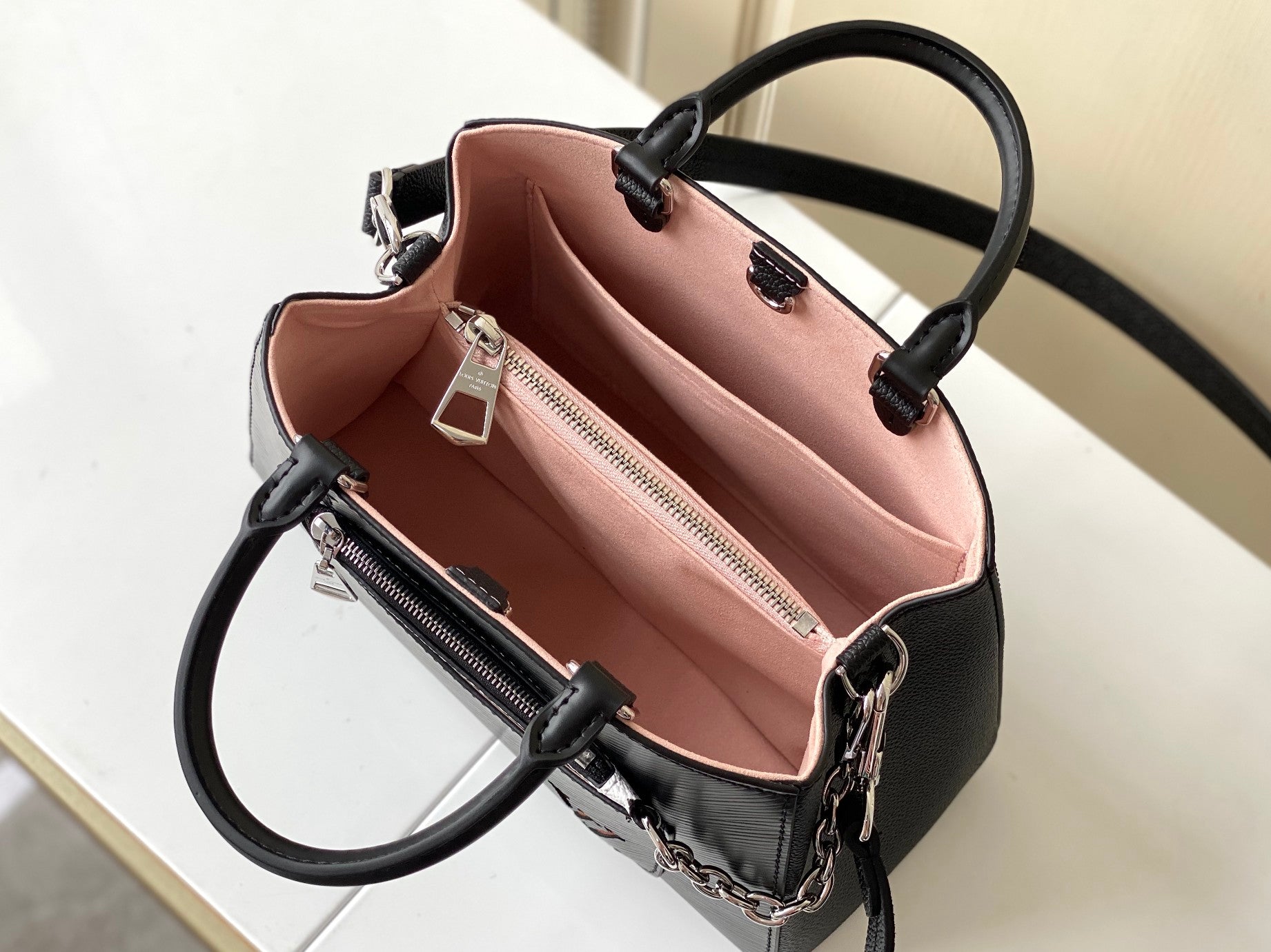 Louis Vuitton Black Top Handle Handbag with Silver Chain and Patterned Front Pocket