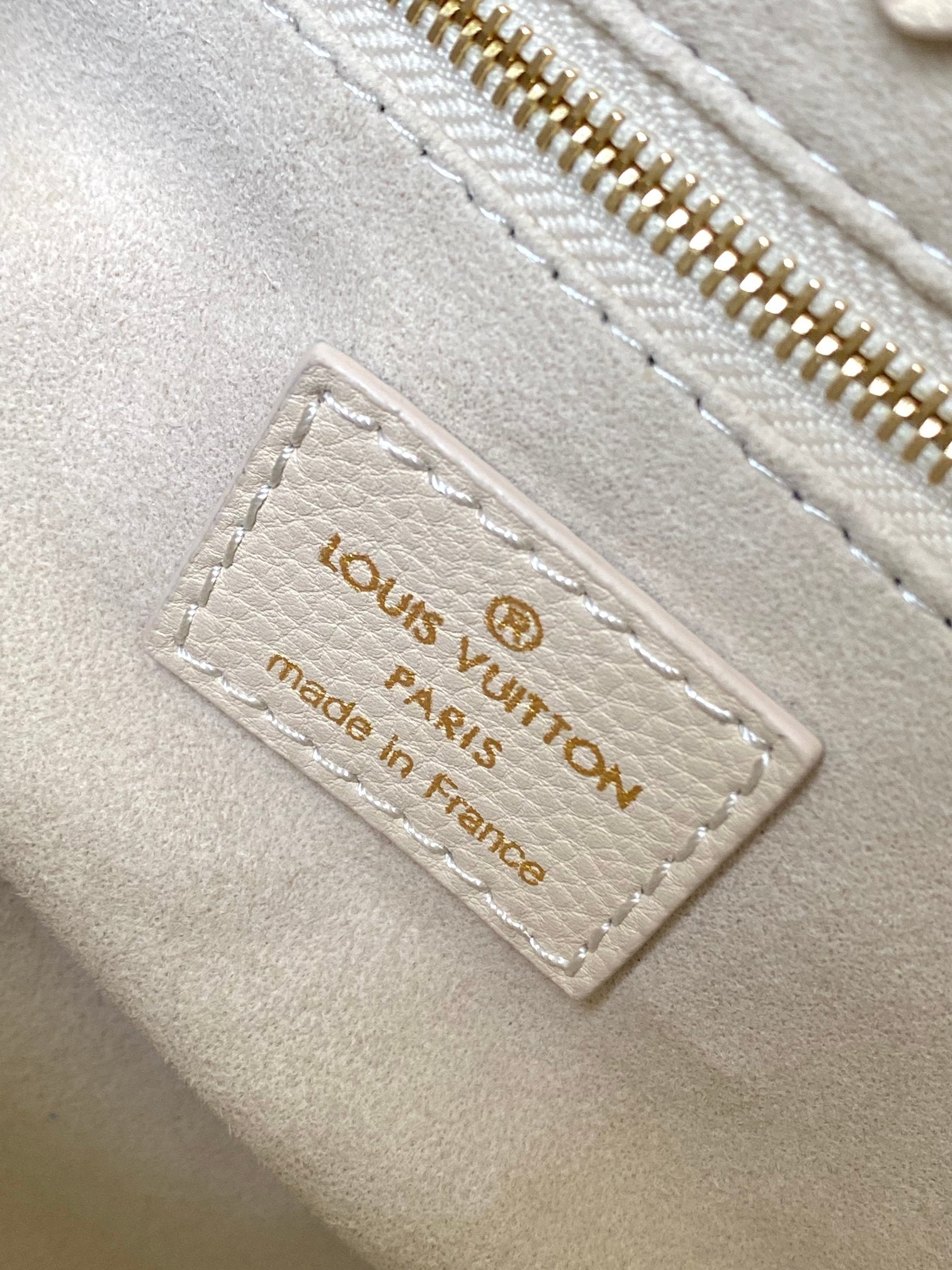 Louis Vuitton Luxury Pastel Pink Leather Tote Bag with Embossed Floral Pattern