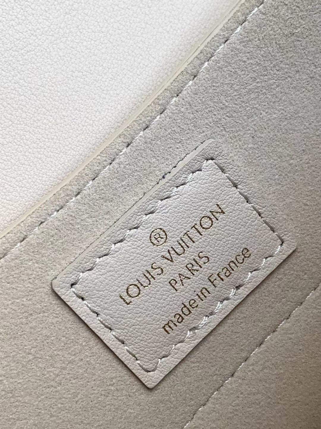 Louis Vuitton Elegant Beige Mini Top Handle Bag with Gold Lock Clasp