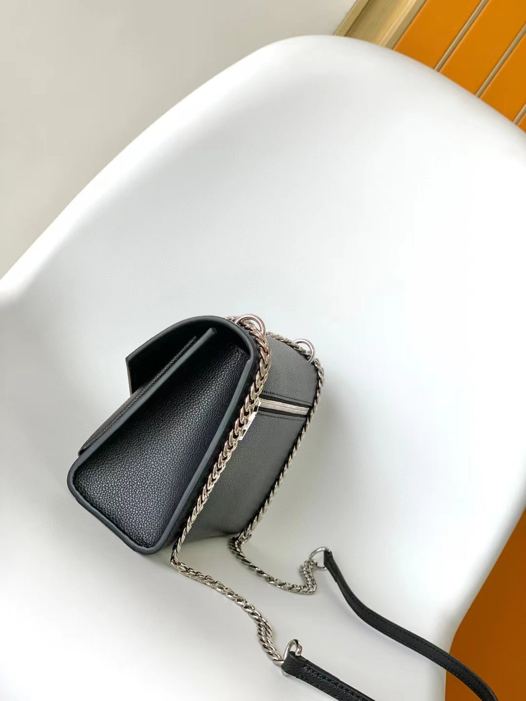 Louis Vuitton Elegant Black Leather Envelope Handbag with Silver Chain Strap