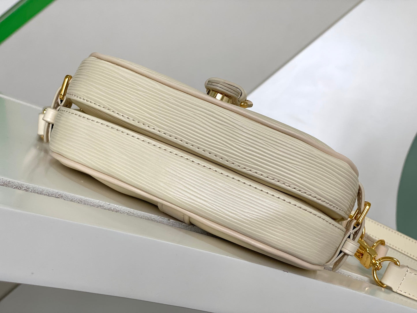 Louis Vuitton Elegant Pale Pink Leather Crossbody Saddle Bag with Gold Hardware