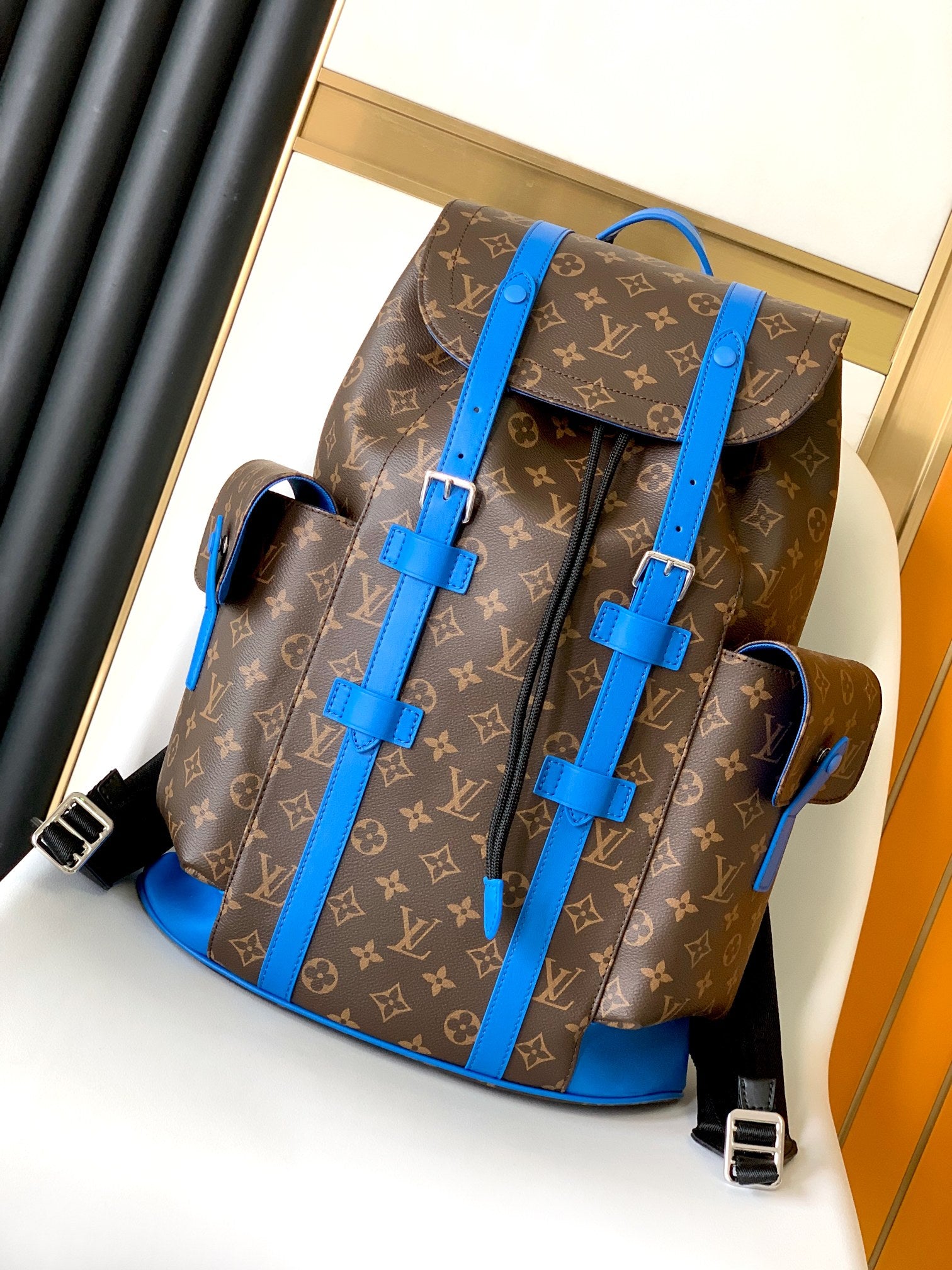 Louis Vuitton Luxury Monogram Canvas Backpack with Bright Blue Leather Straps