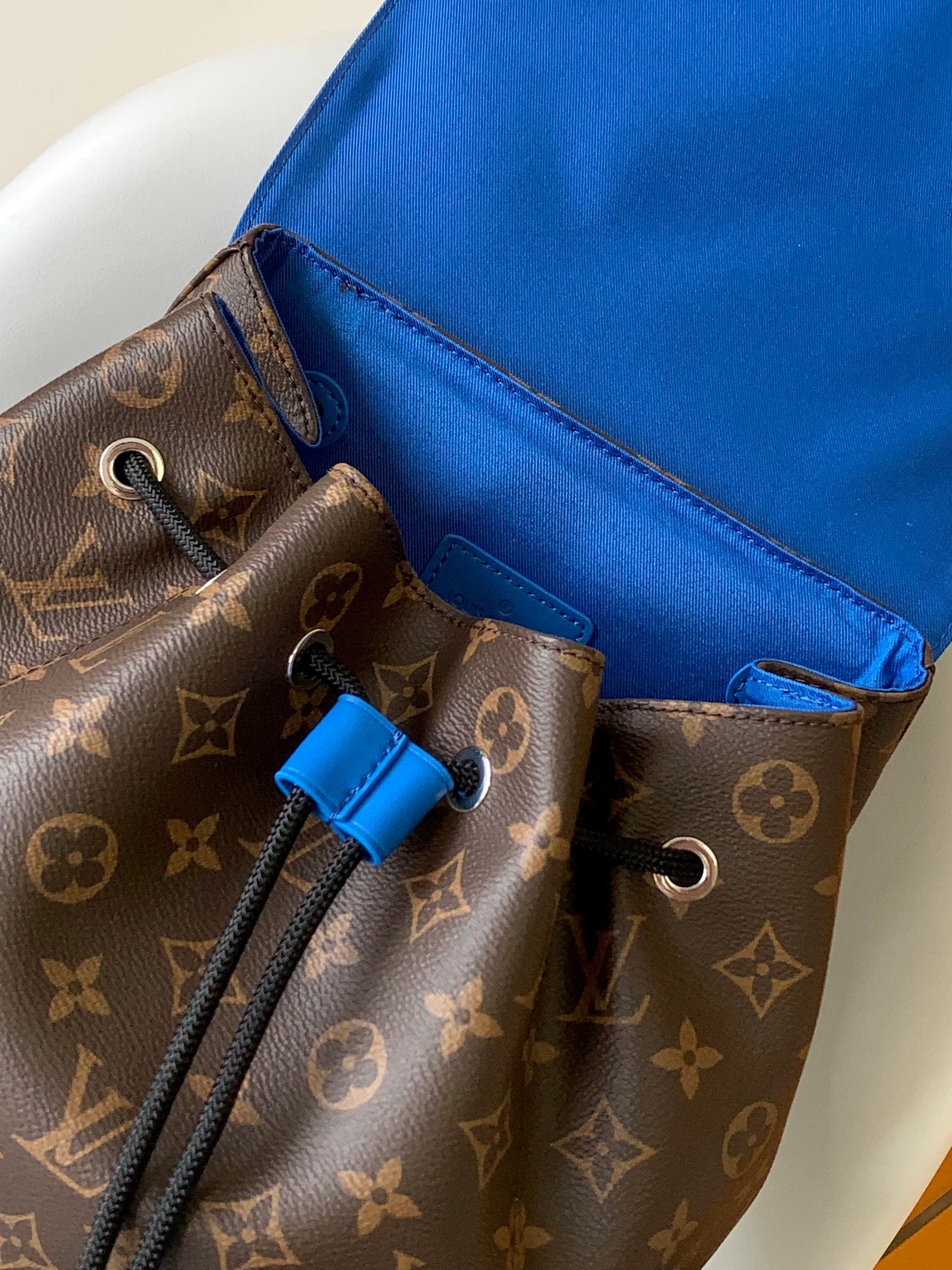 Louis Vuitton Luxury Monogram Canvas Backpack with Bright Blue Leather Straps