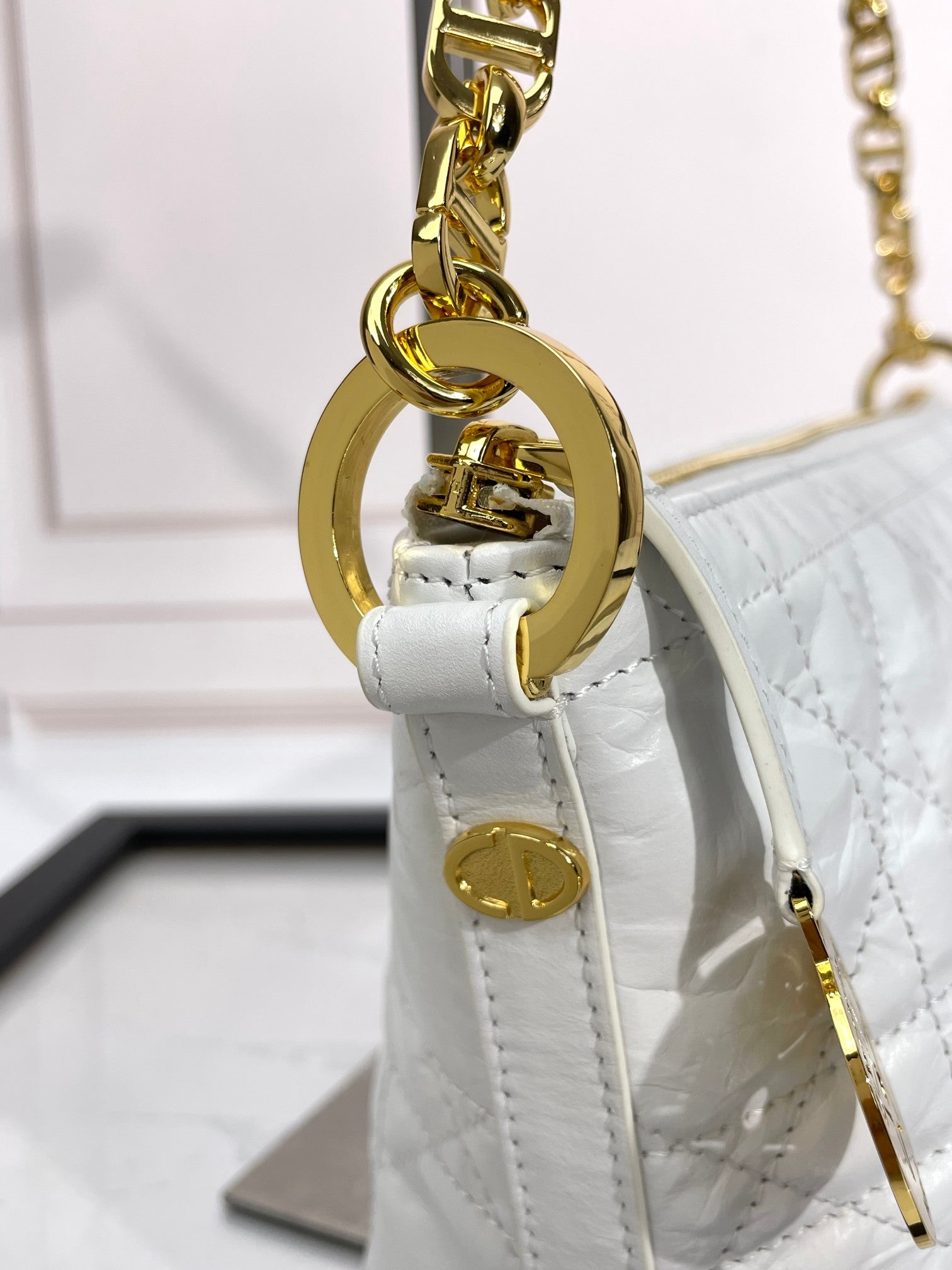 Dior Elegant White Quilted Hobo Handbag with Gold Chain Strap