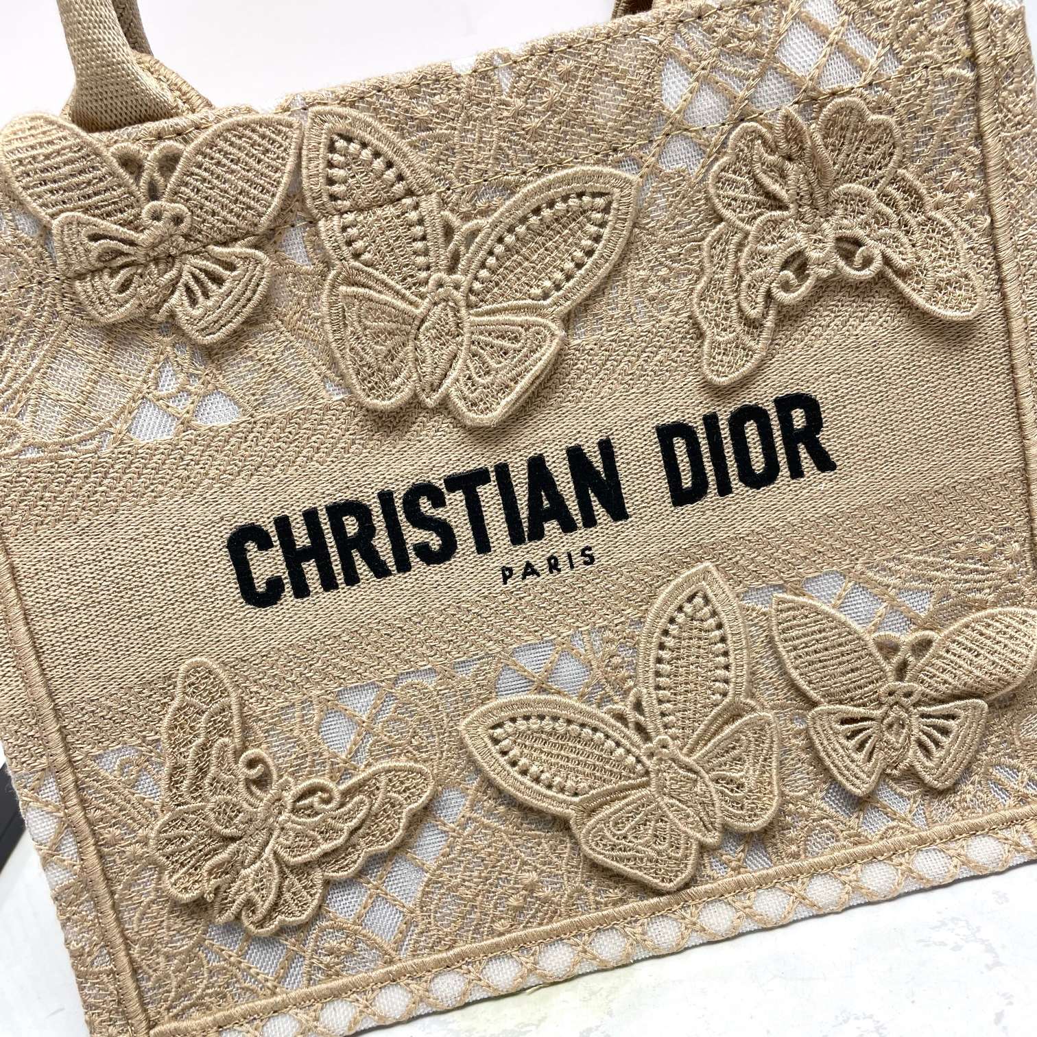 Dior Elegant Beige Canvas Tote Bag with Embroidered Butterfly Details