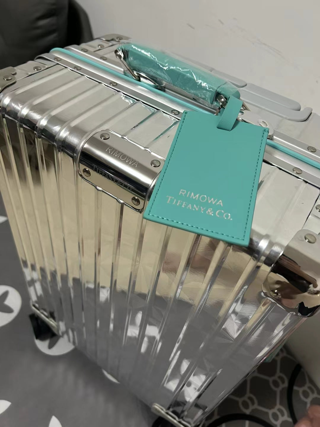 Metallic Silver Ribbed Hard Shell Carry-On Suitcase with Teal Accents
