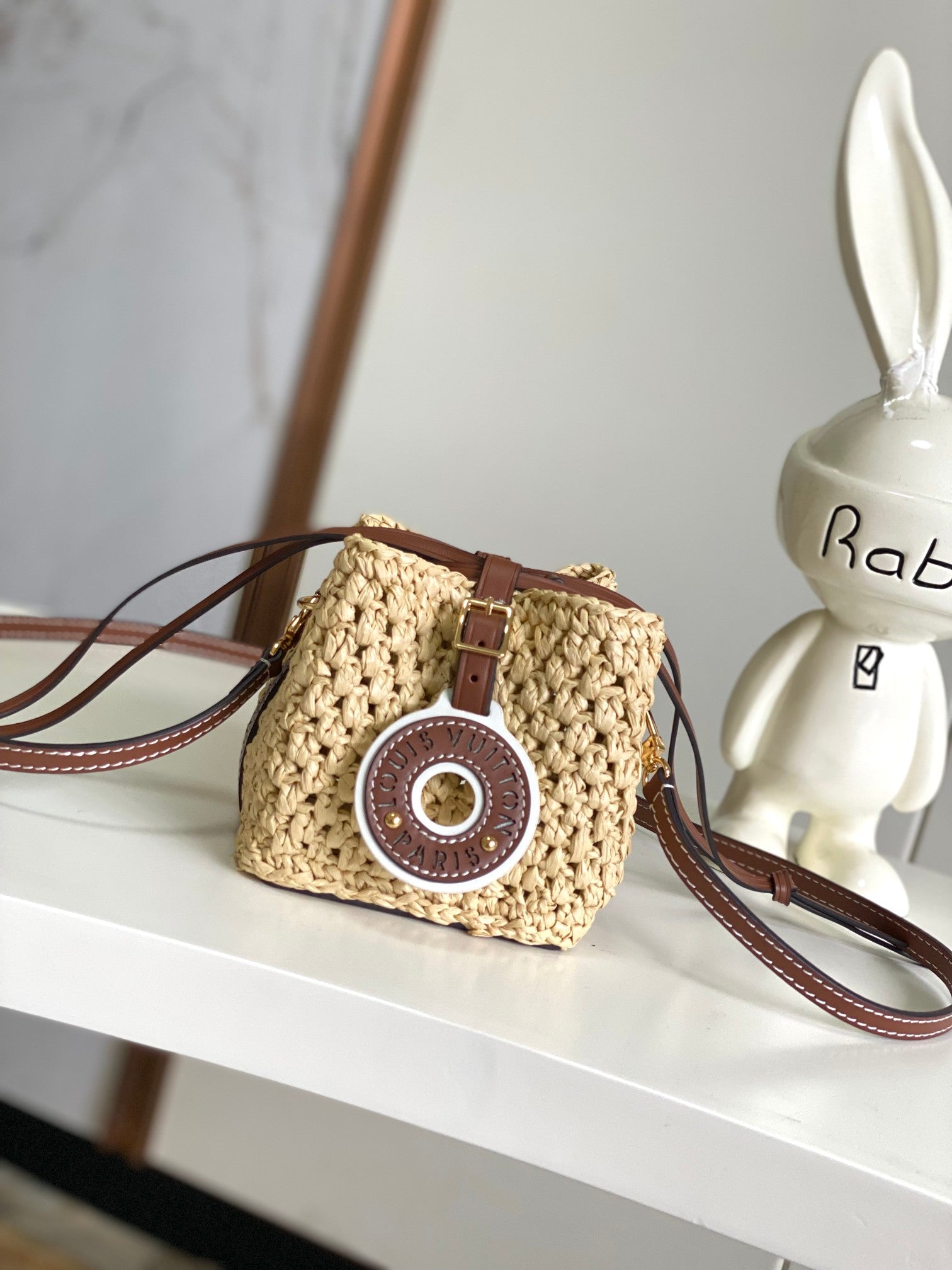 Louis Vuitton Woven Straw Crossbody Bucket Bag with Brown Leather Details