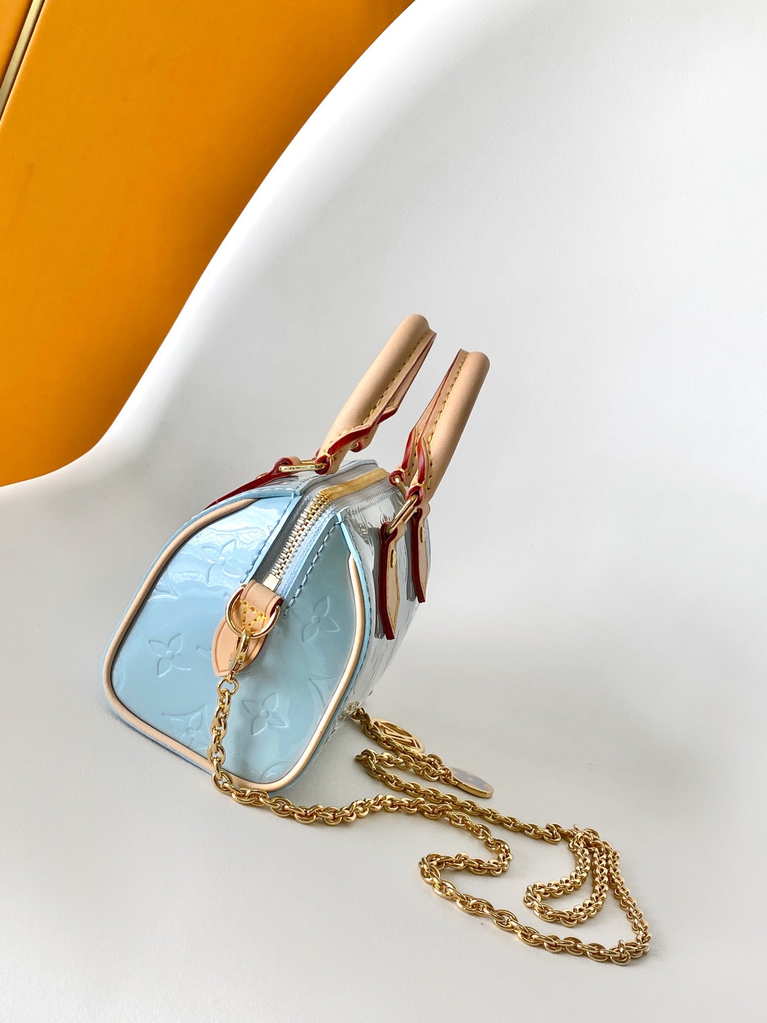 Louis Vuitton Pastel Blue Embossed Crossbody Barrel Bag with Gold Chain and Heart Charm