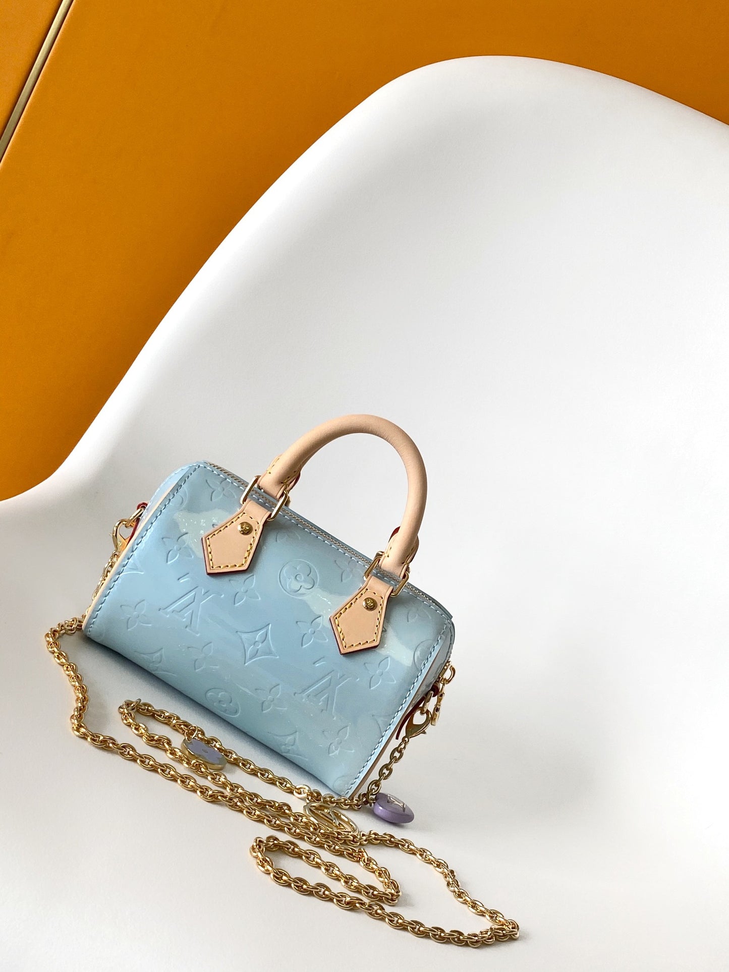 Louis Vuitton Pastel Blue Embossed Crossbody Barrel Bag with Gold Chain and Heart Charm