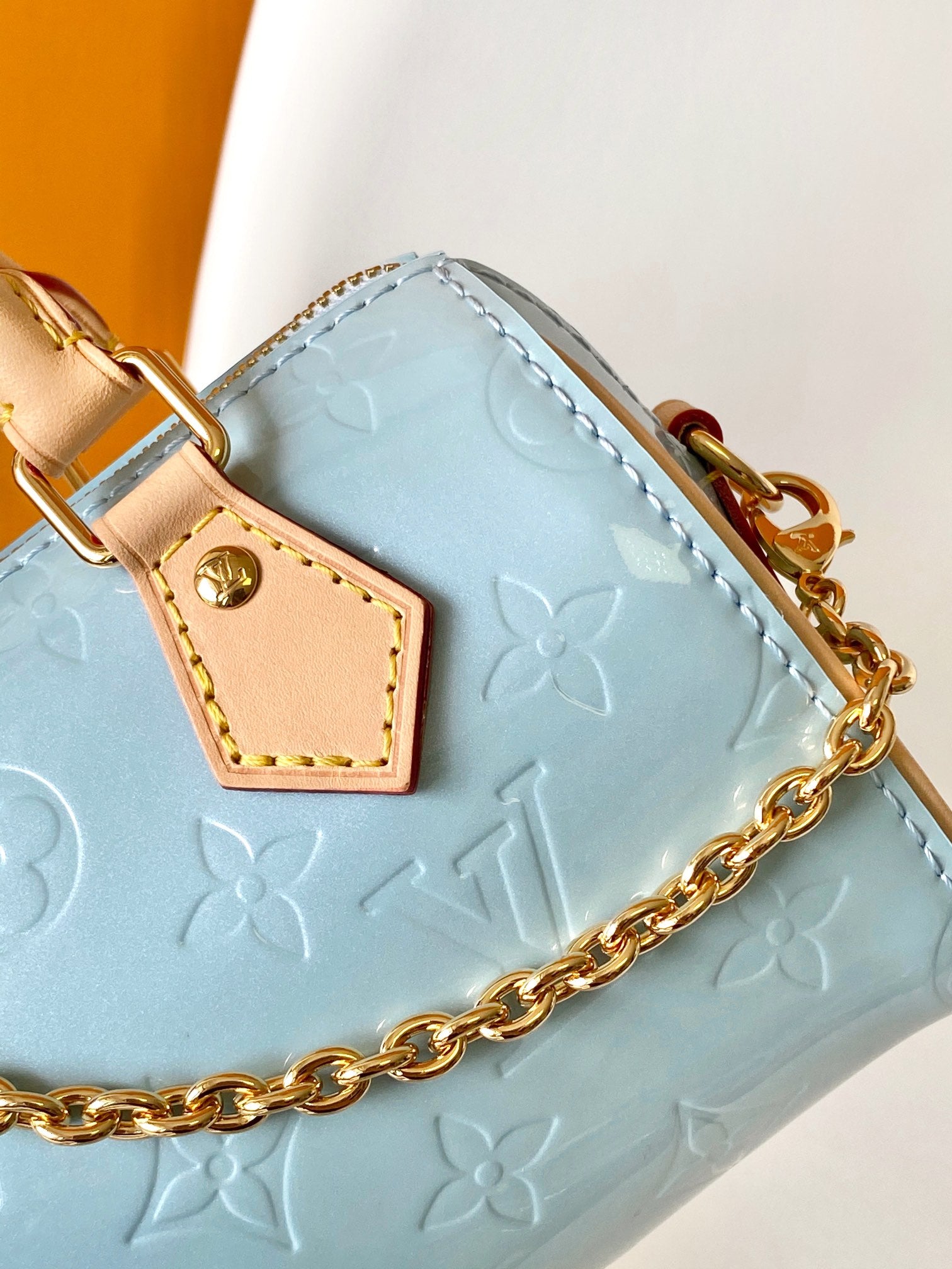 Louis Vuitton Pastel Blue Embossed Crossbody Barrel Bag with Gold Chain and Heart Charm