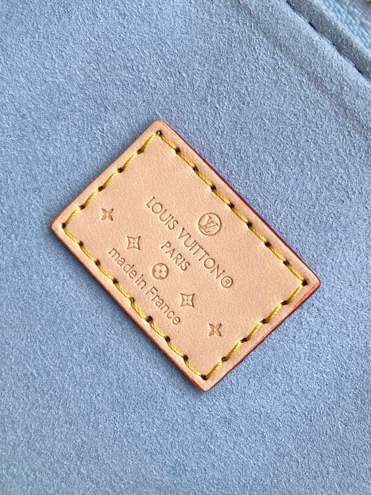 Louis Vuitton Pastel Blue Embossed Crossbody Barrel Bag with Gold Chain and Heart Charm