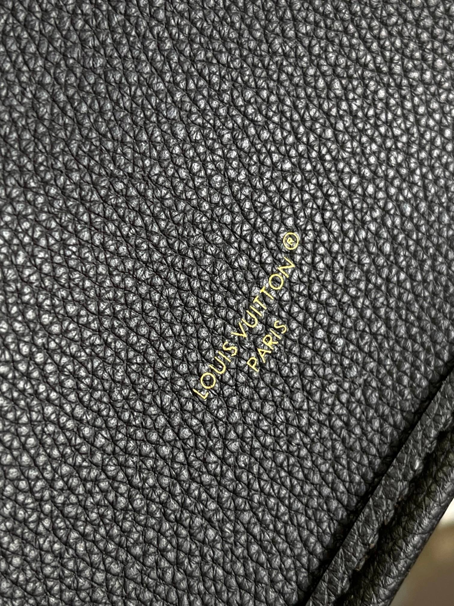 Louis Vuitton Elegant Black Pebbled Leather Tote Bag with Gold Clasp and Strap
