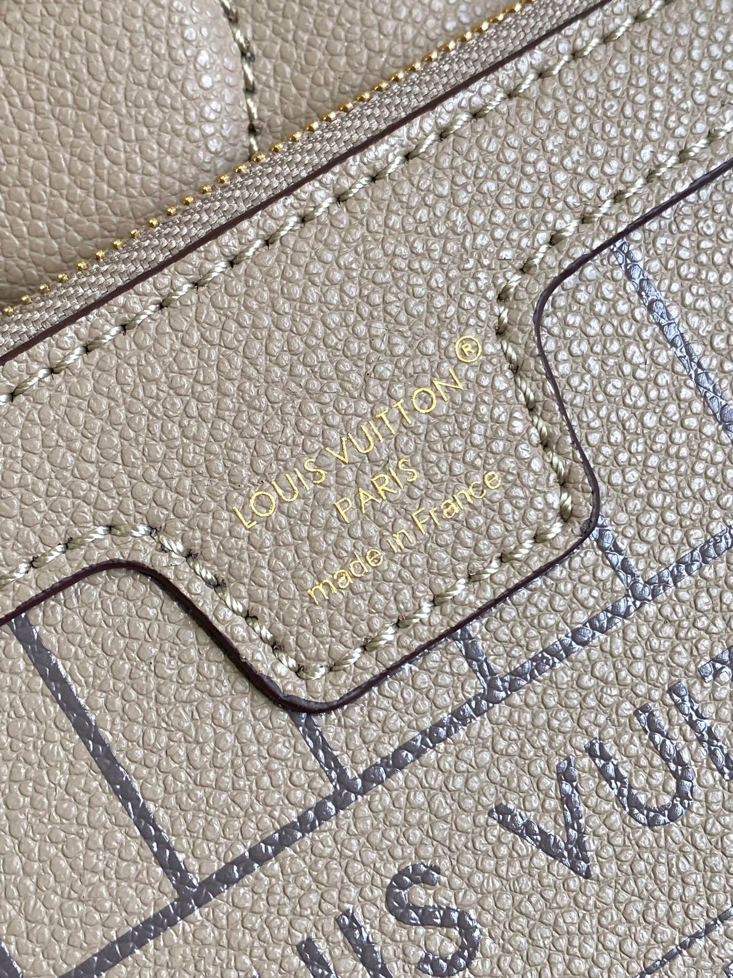 Louis Vuitton Classic Taupe Leather Bucket Bag with Top Handle and Strap