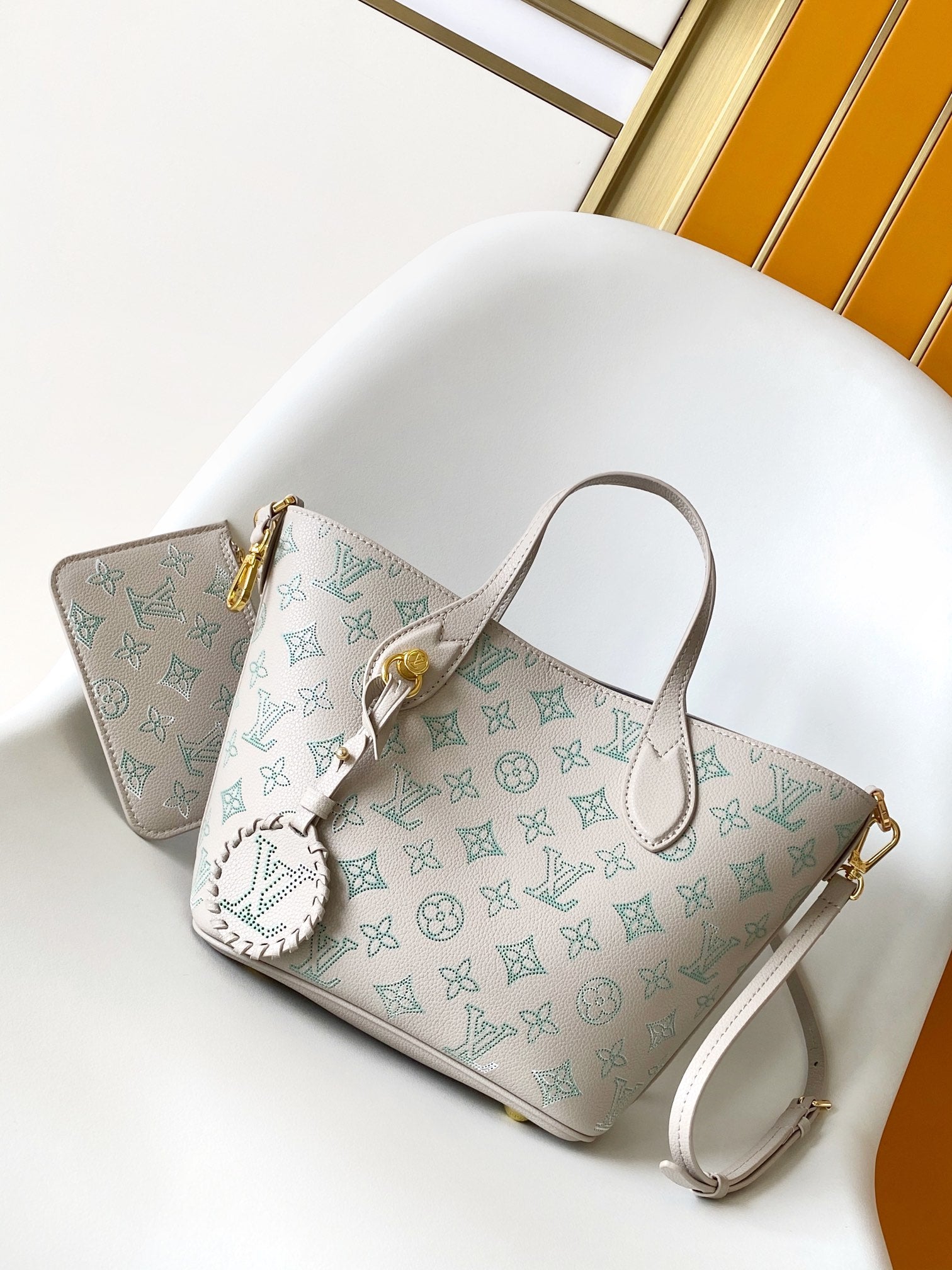 Louis Vuitton Elegant Light Pink Monogram Leather Tote Bag with Charm