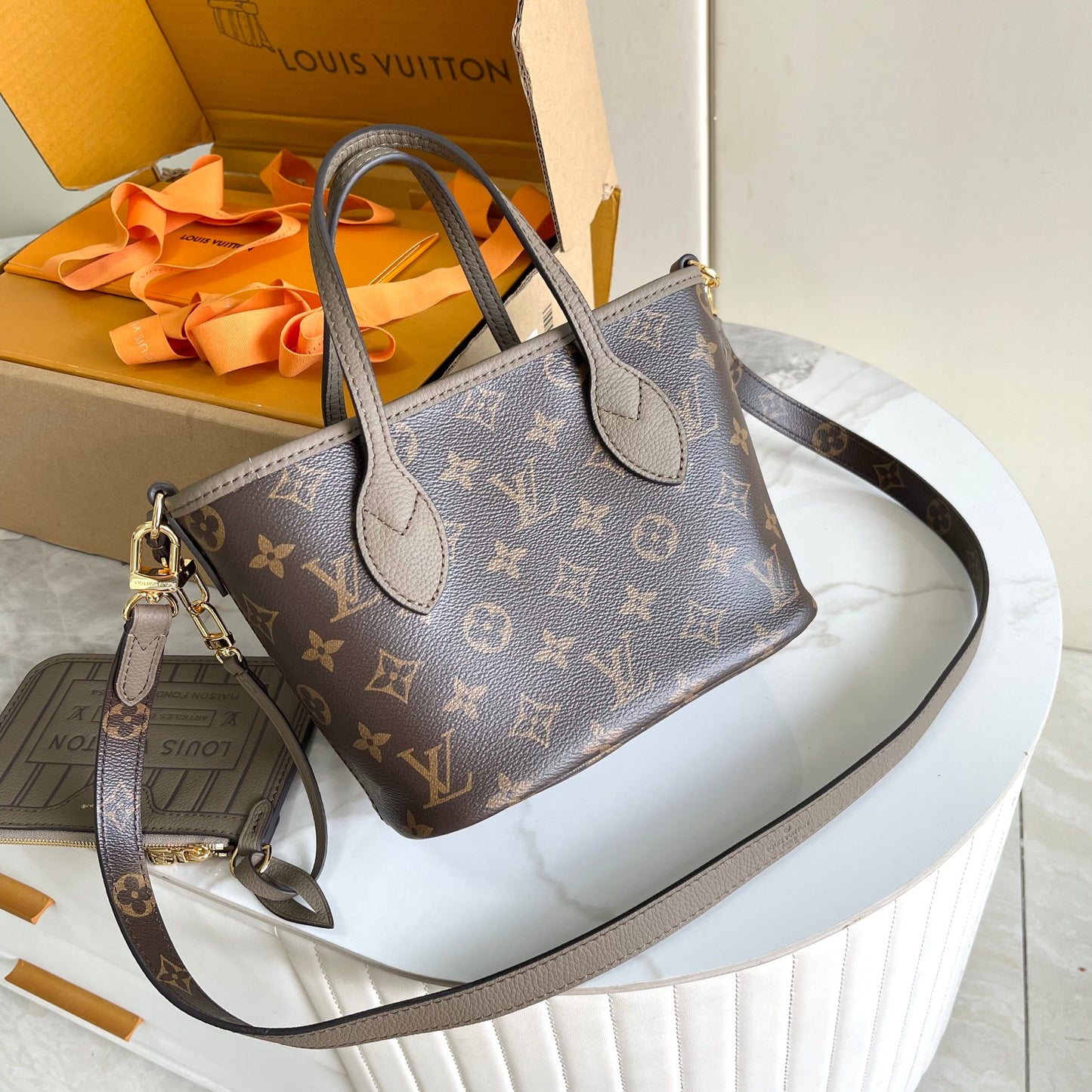 Louis Vuitton Taupe Leather Bucket Handbag with Top Handles and Shoulder Strap