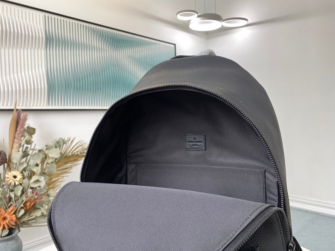 Louis Vuitton Luxury Matte Black Textured Leather Backpack with Pocket