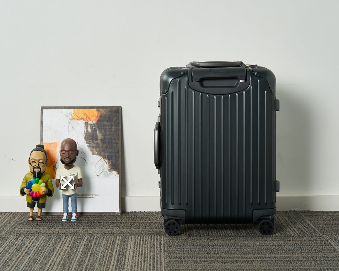 Sleek Black Ribbed Hardshell Carry-On Suitcase with Spinner Wheels