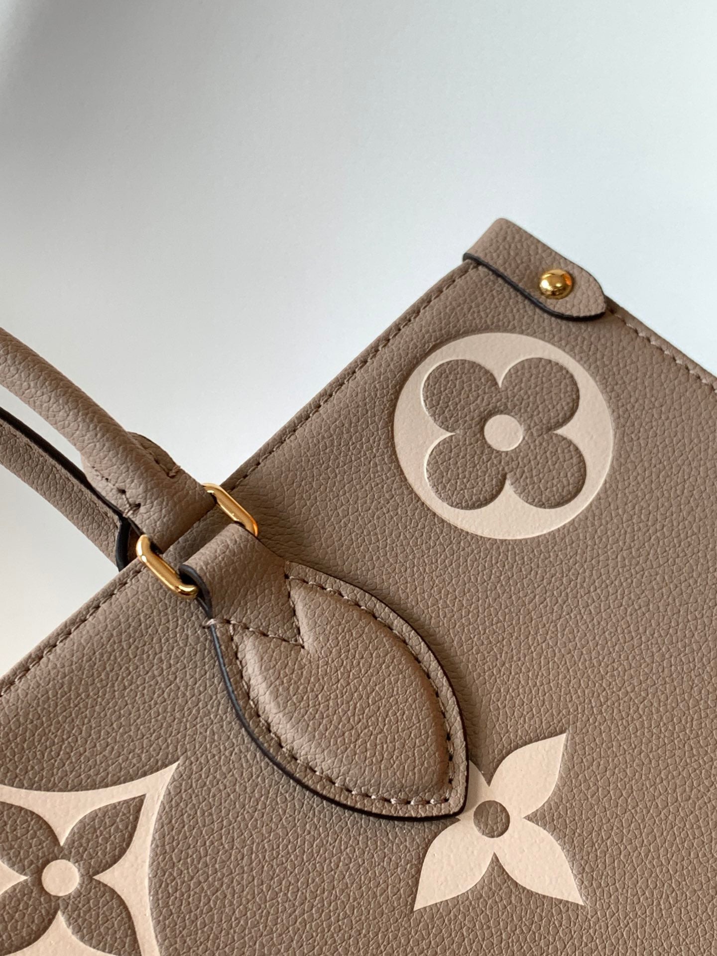 Louis Vuitton Elegant Taupe Leather Tote Bag with Large Embossed Monogram