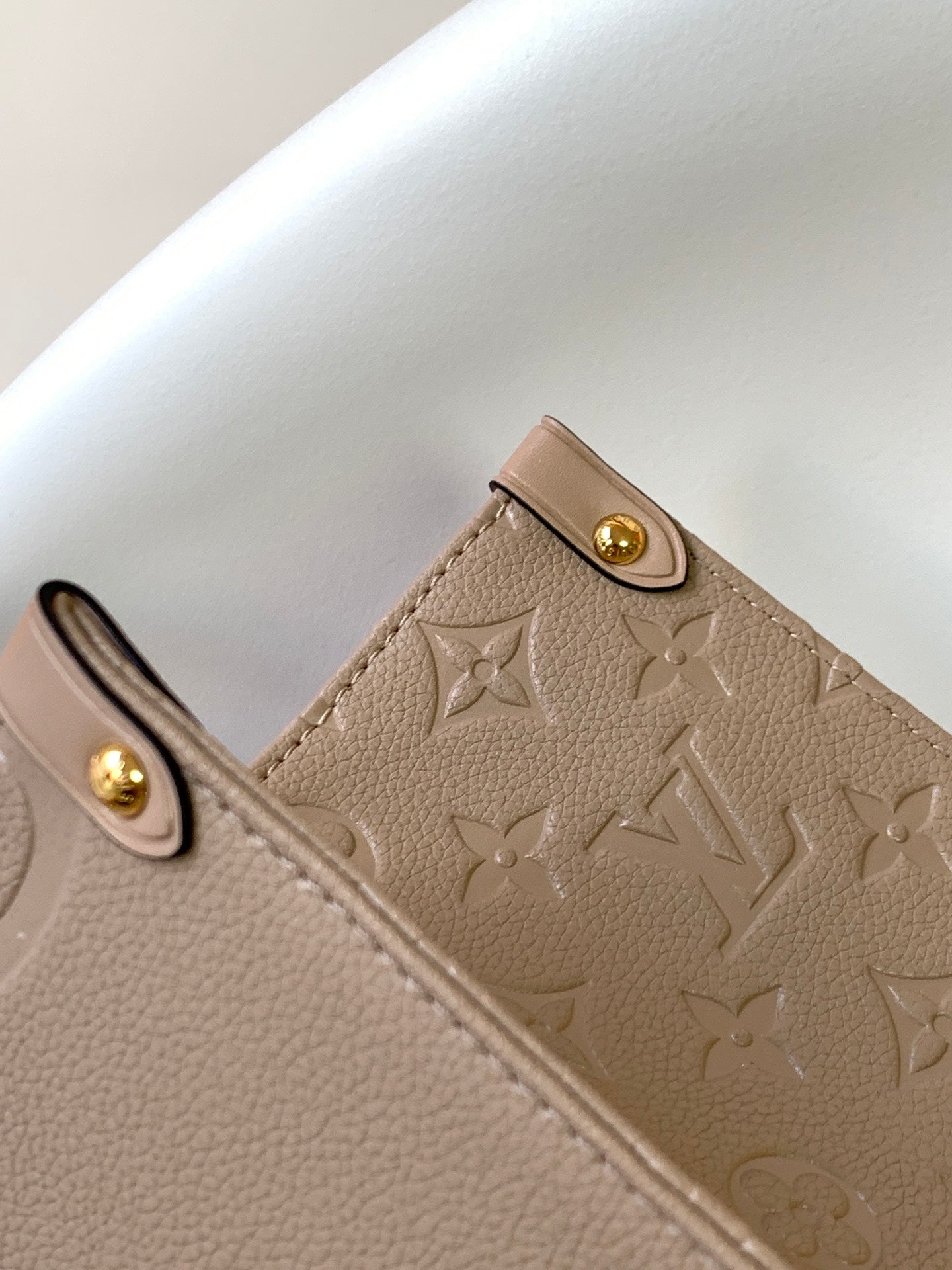Louis Vuitton Elegant Taupe Embossed Leather Tote Bag with Top Handles