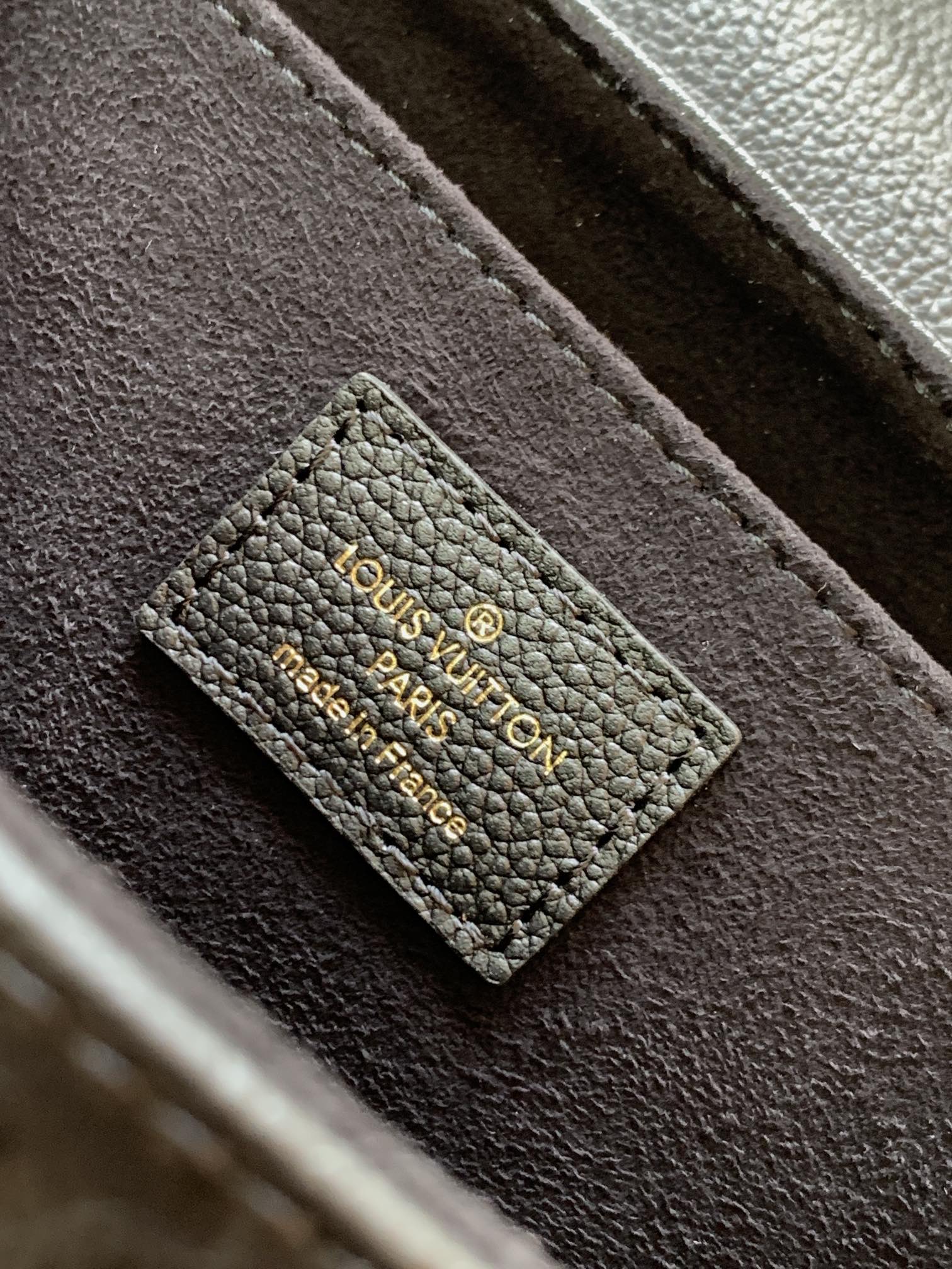 Louis Vuitton Elegant Black Embossed Leather Flap Bag with Gold Chain