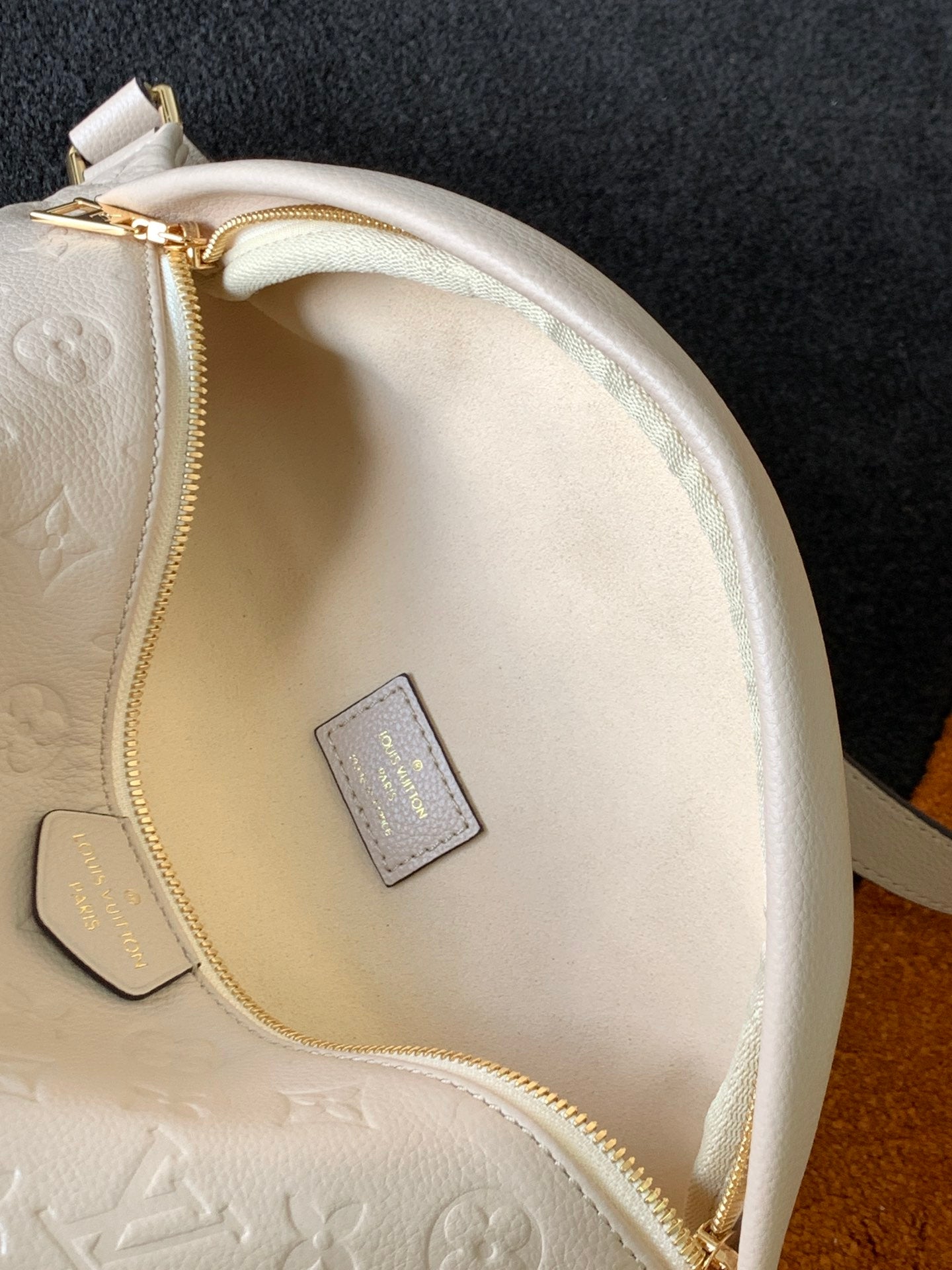 Louis Vuitton Luxury Off-White Embossed Leather Belt Bag with Gold Hardware