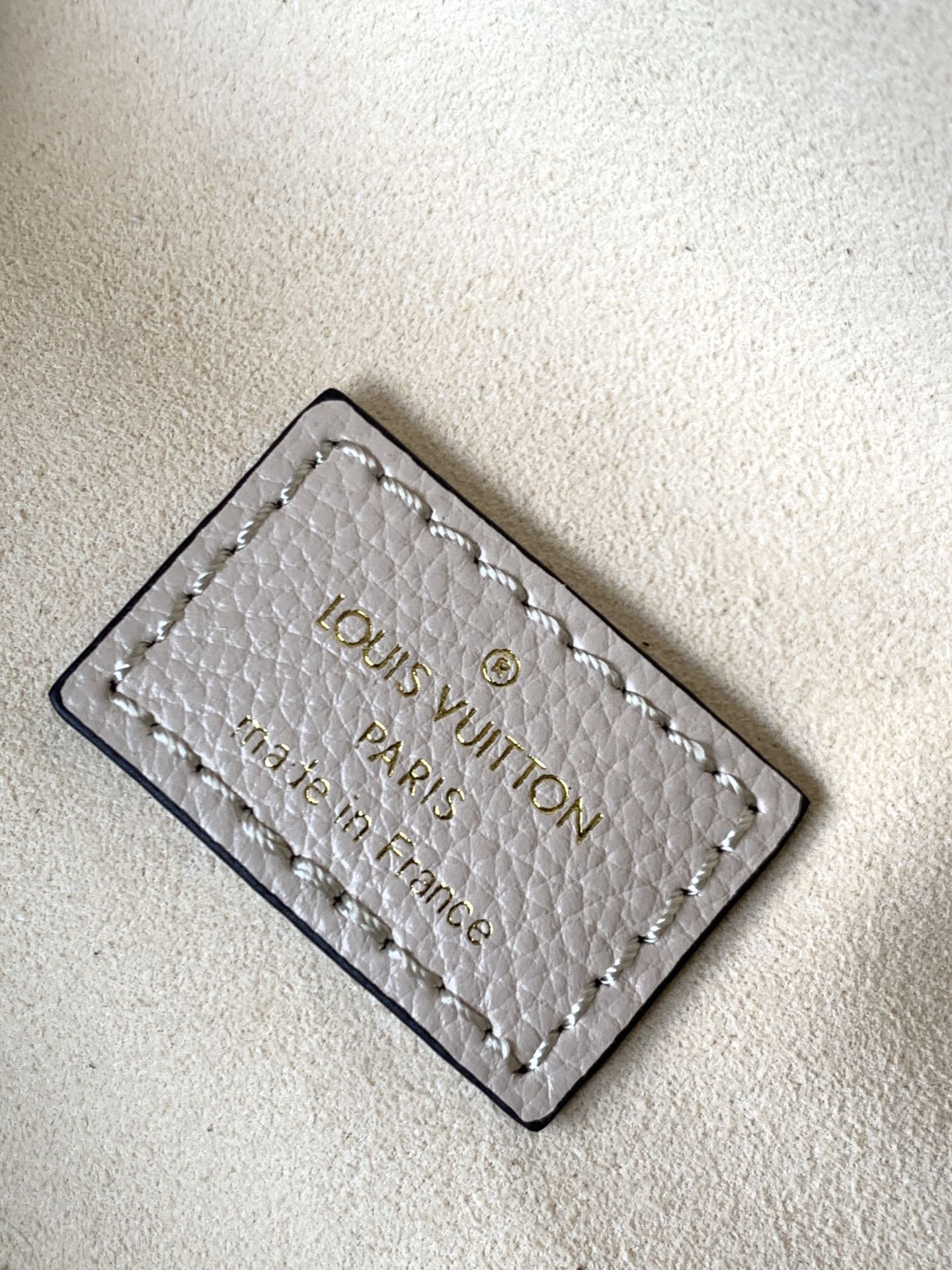 Louis Vuitton Luxury Off-White Embossed Leather Belt Bag with Gold Hardware