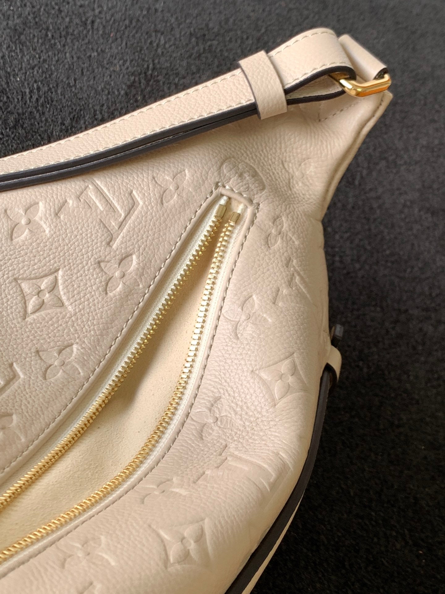 Louis Vuitton Luxury Off-White Embossed Leather Belt Bag with Gold Hardware