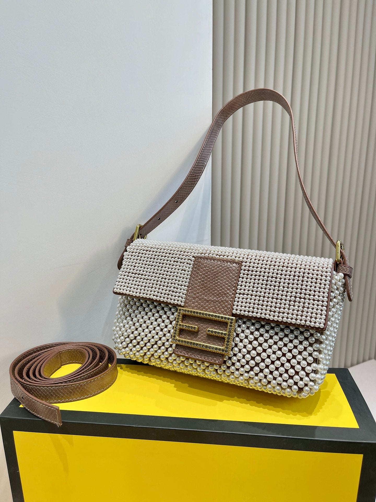 Elegant Textured Weave Baguette Shoulder Bag with Gold-Tone Buckle - Cream and Black