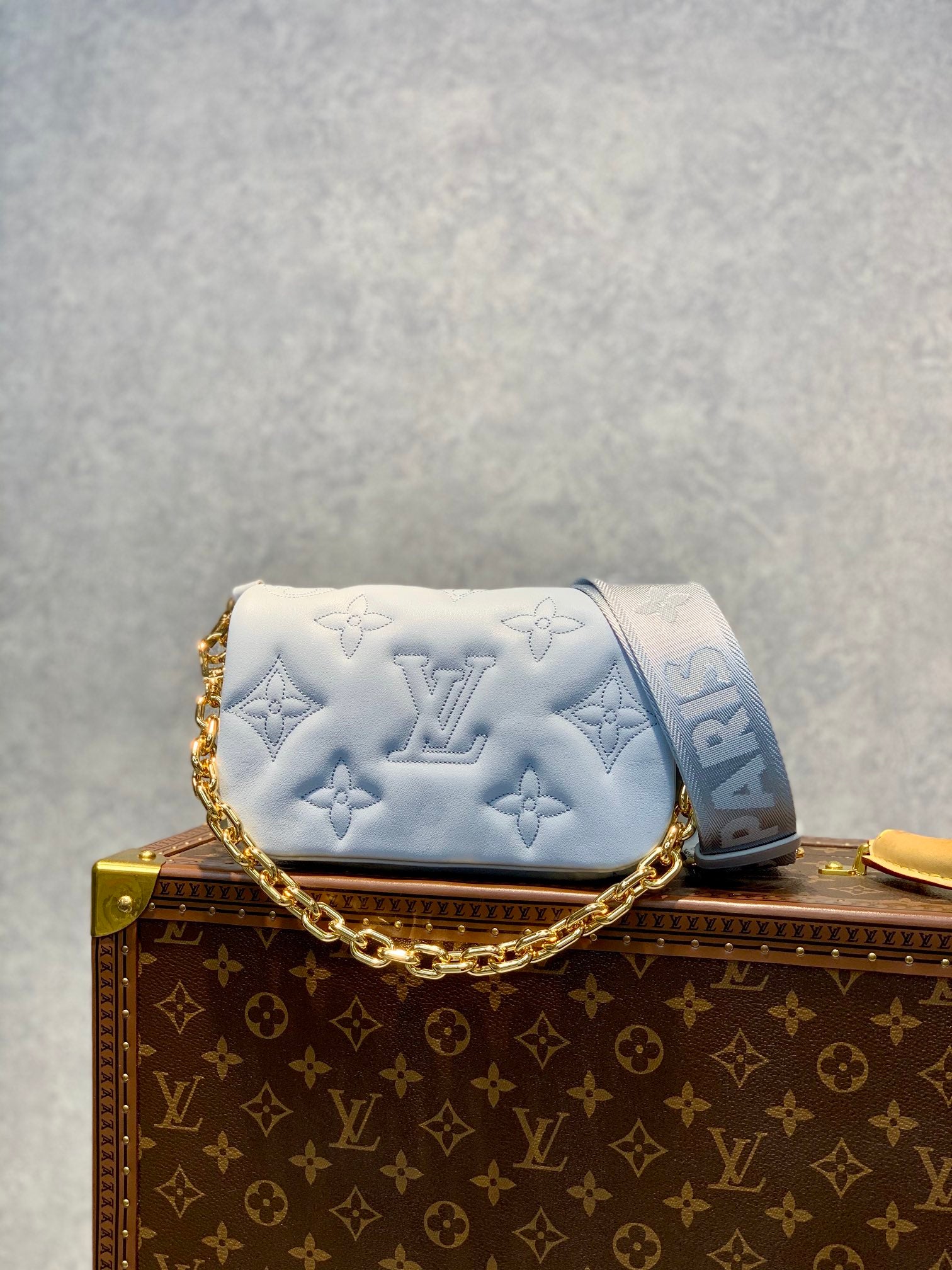 Louis Vuitton Light Blue Embossed Crossbody Bag with Wide Strap and Gold Chain
