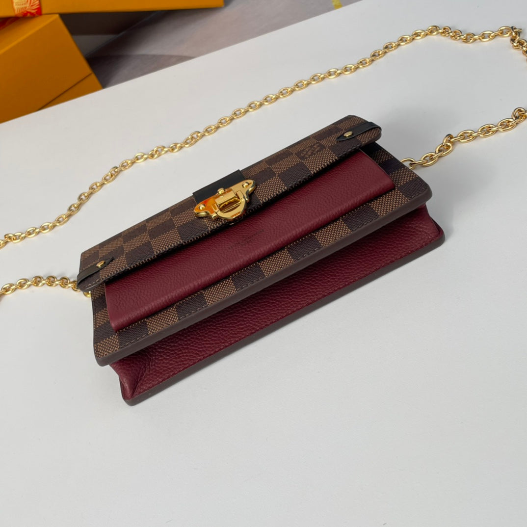 Louis Vuitton Brown Checkered Crossbody Bag with Gold Chain and Red Accent