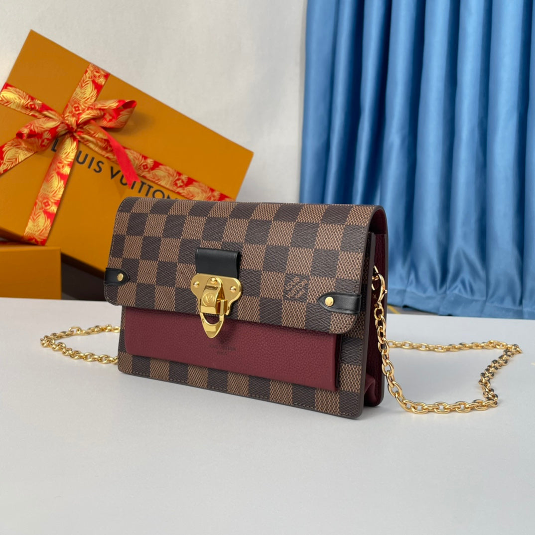Louis Vuitton Brown Checkered Crossbody Bag with Gold Chain and Red Accent