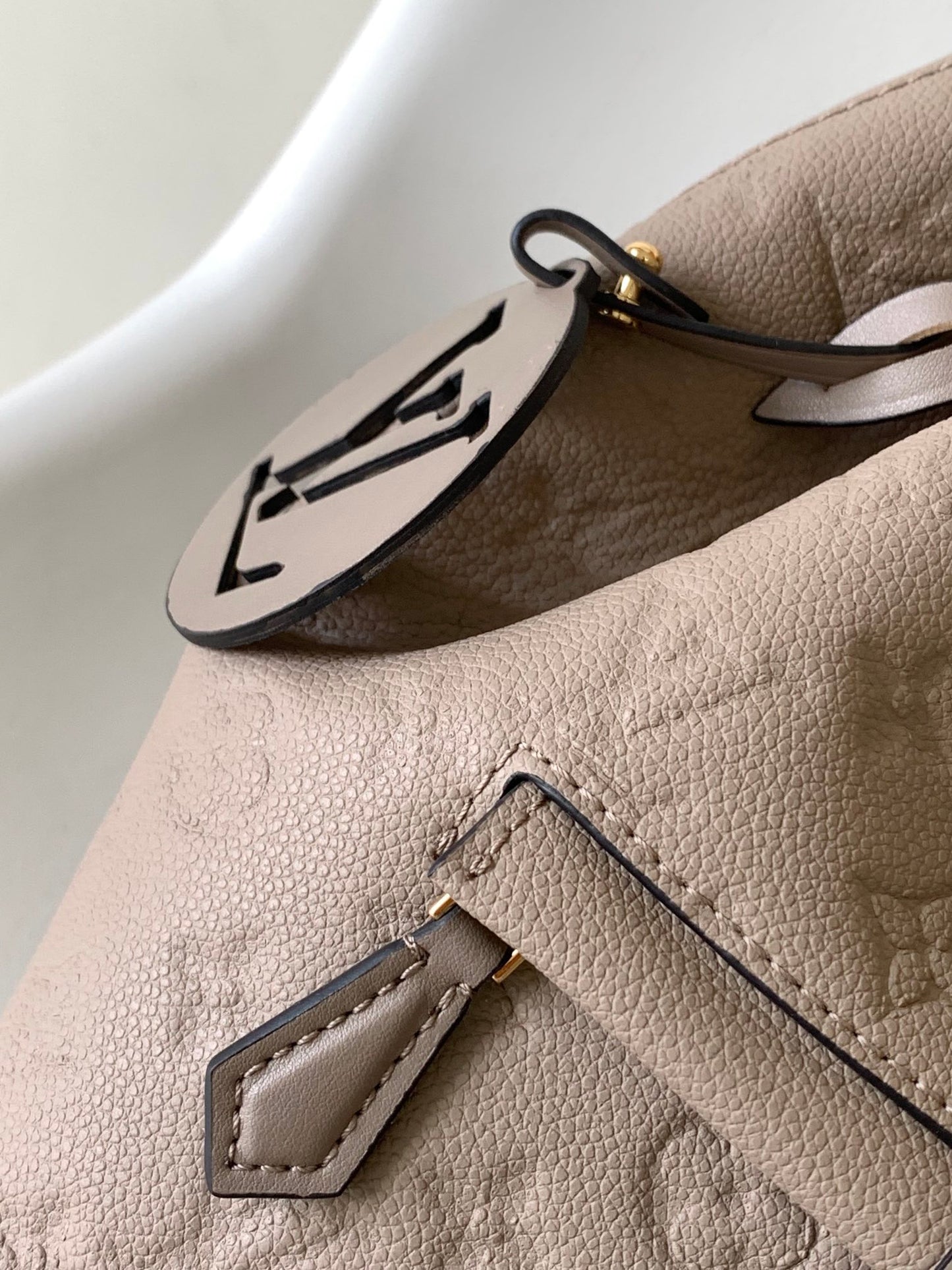 Louis Vuitton Elegant Taupe Embossed Leather Mini Backpack with Flap Closure