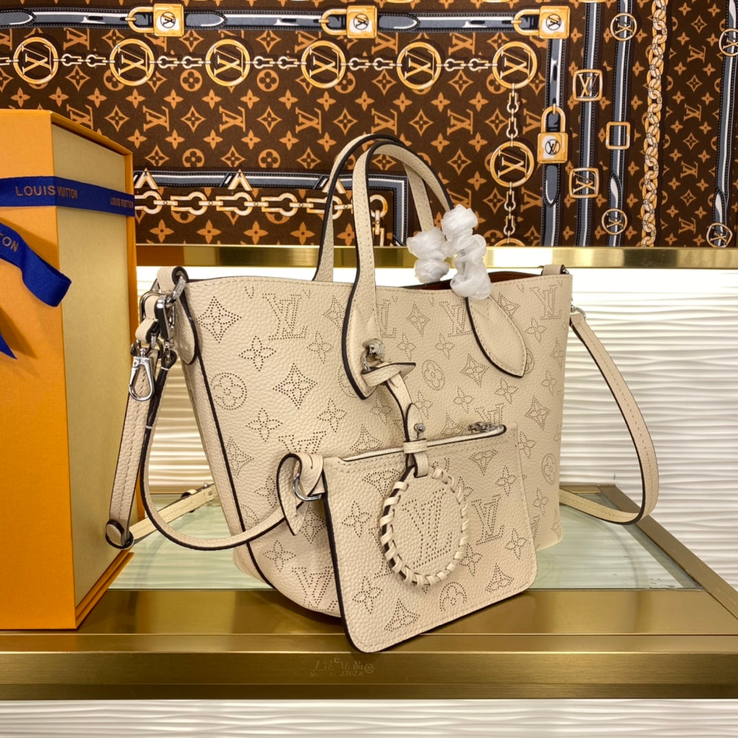 Louis Vuitton Luxury Cream Perforated Leather Tote Bag with Round Charm