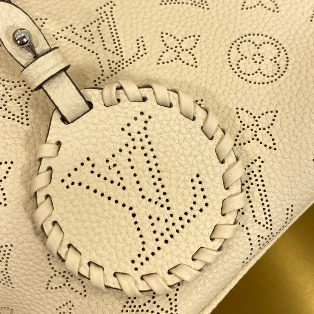 Louis Vuitton Luxury Cream Perforated Leather Tote Bag with Round Charm