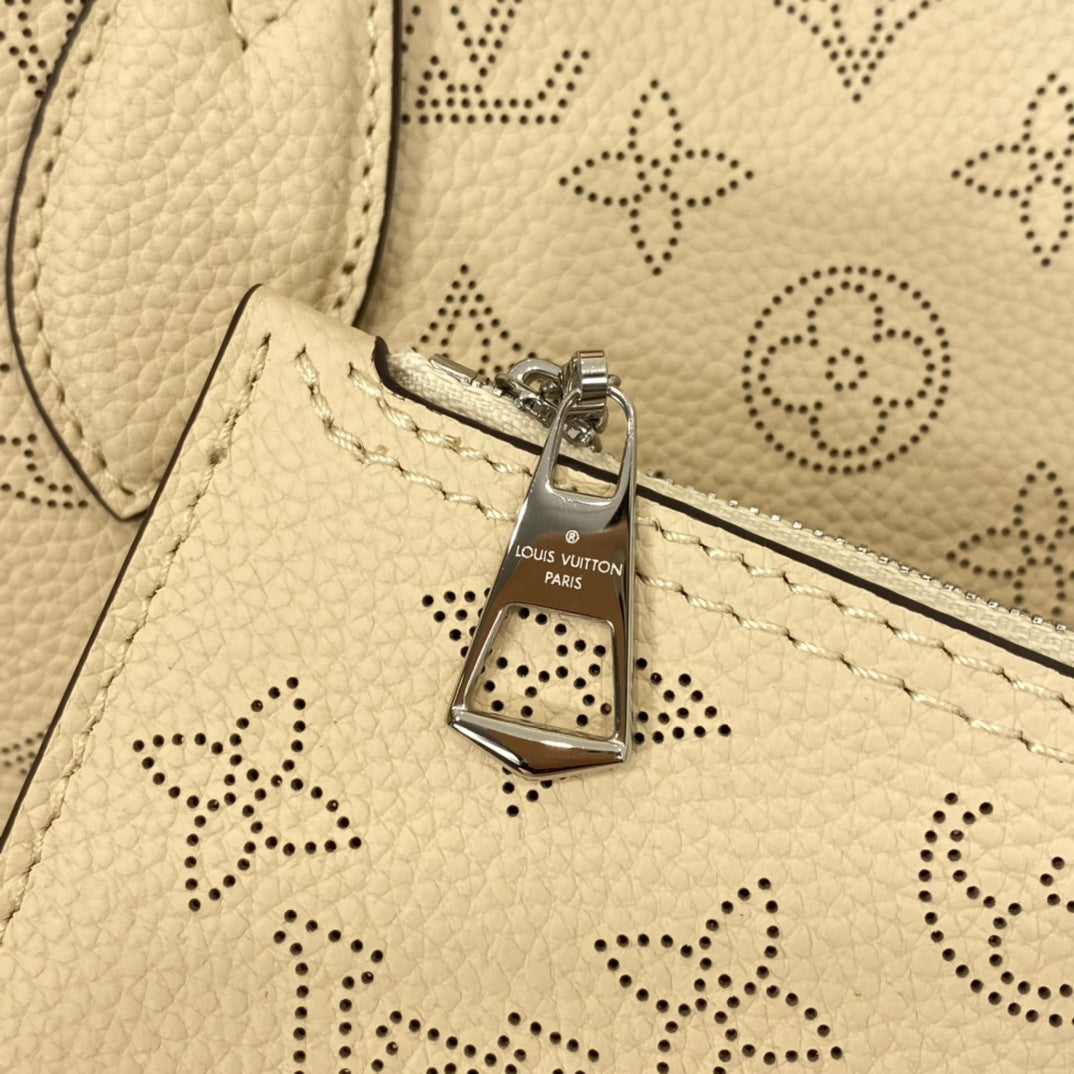 Louis Vuitton Luxury Cream Perforated Leather Tote Bag with Round Charm