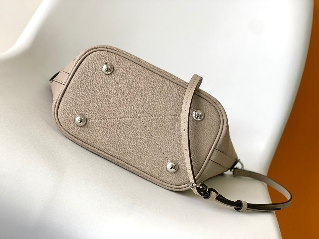 Louis Vuitton Elegant Taupe Perforated Leather Tote Handbag with Charm