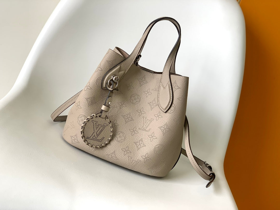 Louis Vuitton Elegant Taupe Perforated Leather Tote Handbag with Charm