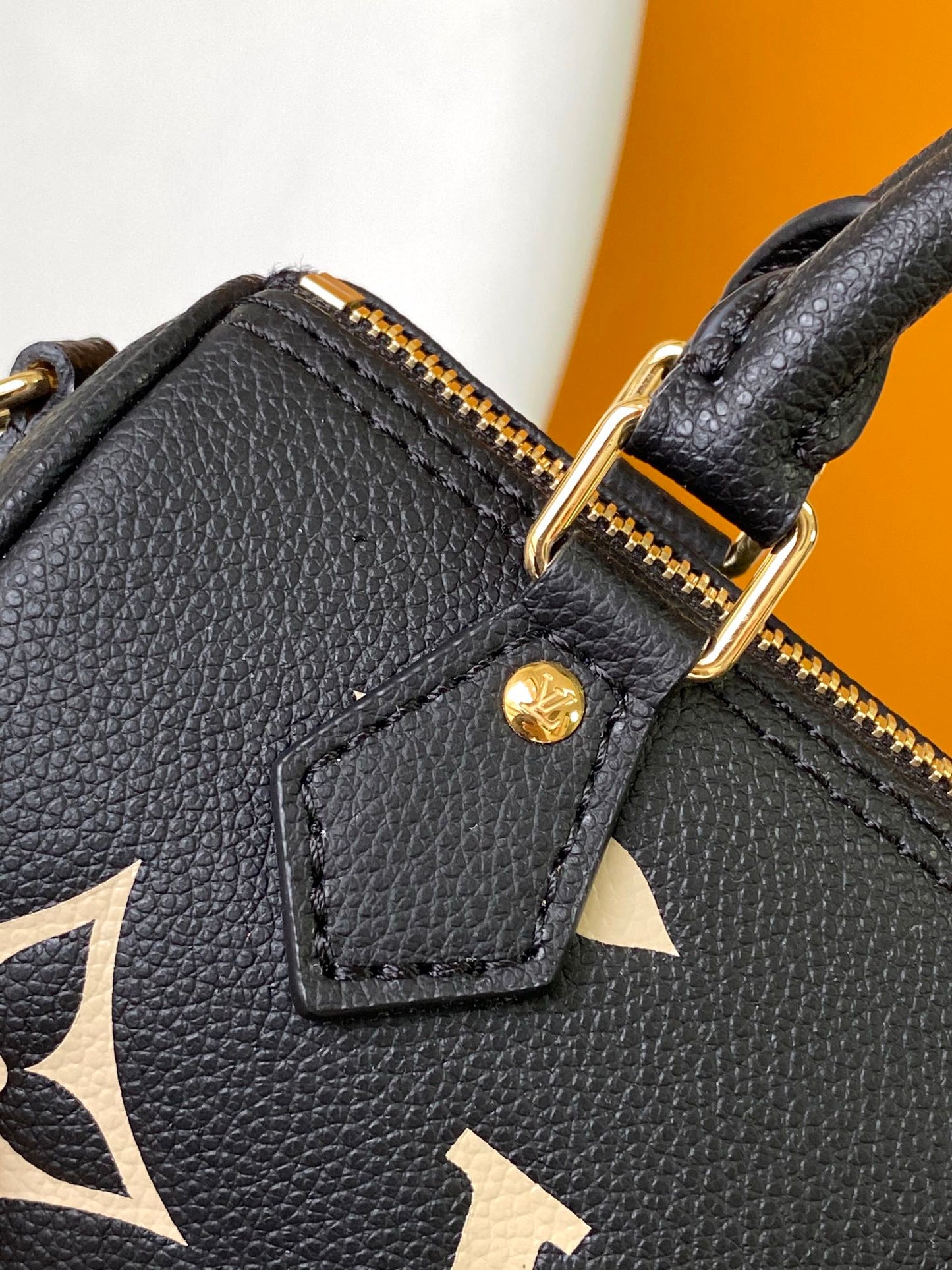 Louis Vuitton Elegant Black Mini Barrel Handbag with Gold Monogram Motifs