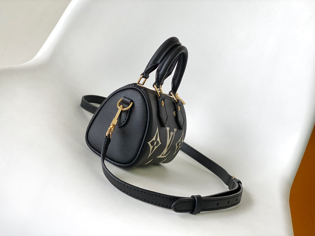Louis Vuitton Elegant Black Mini Barrel Handbag with Gold Monogram Motifs