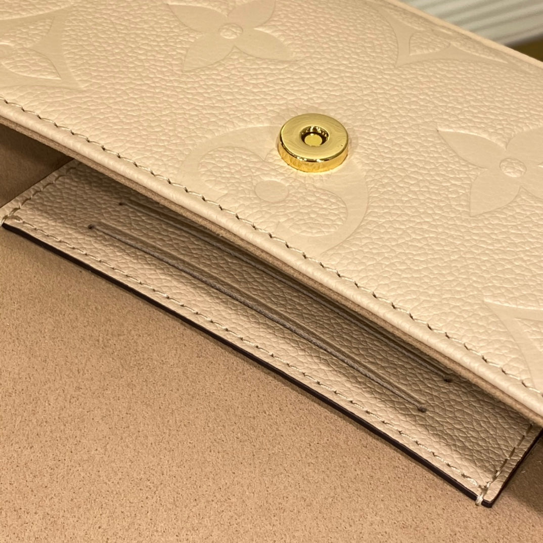 Louis Vuitton Lexington Pouch Monogram Empreinte Leather - Cream