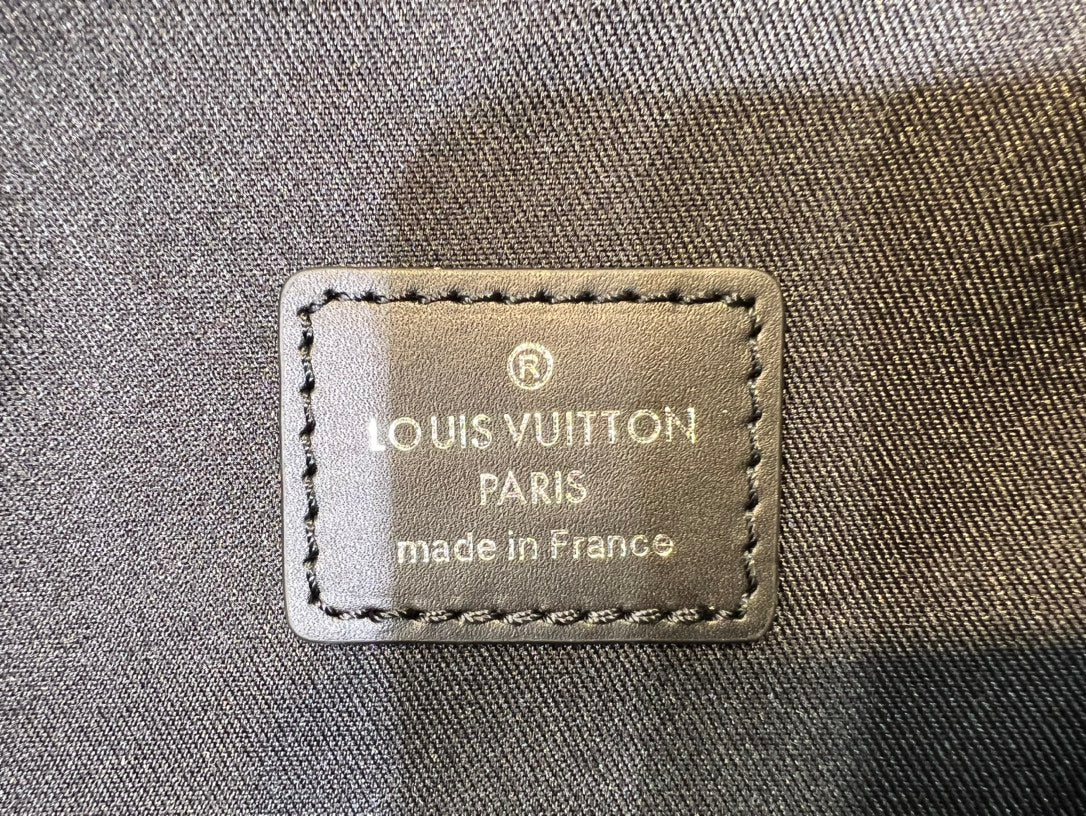 Louis Vuitton Black Woven Leather Texture Unisex Backpack with Zip Front Pocket