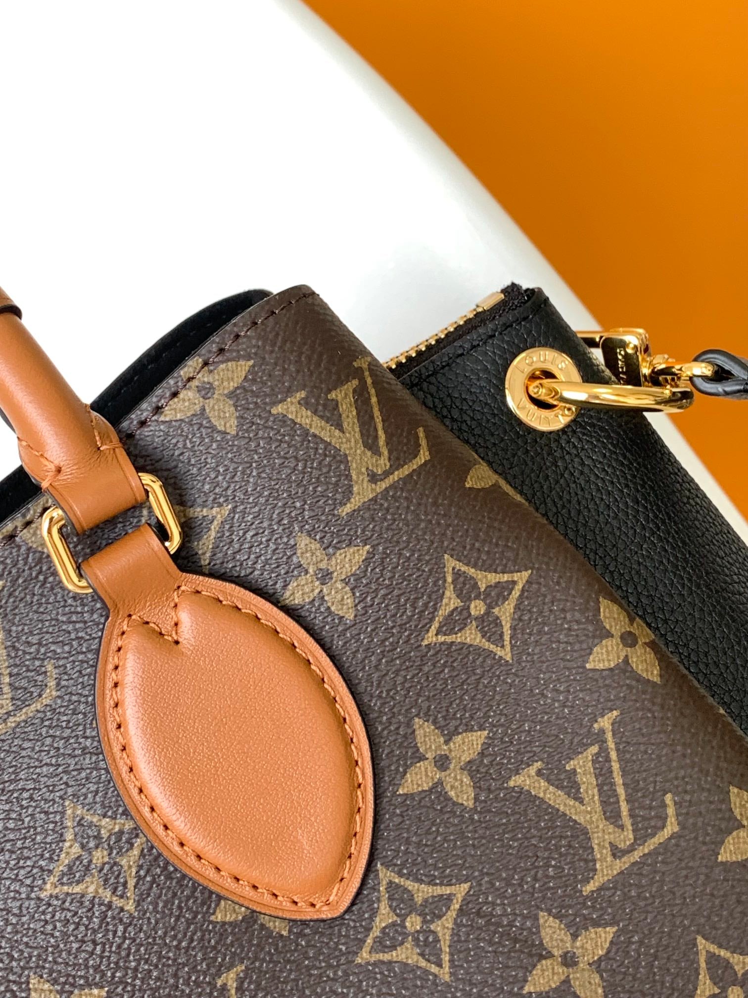 Louis Vuitton Luxury Brown Monogram Canvas Handbag with Tan Leather Handles